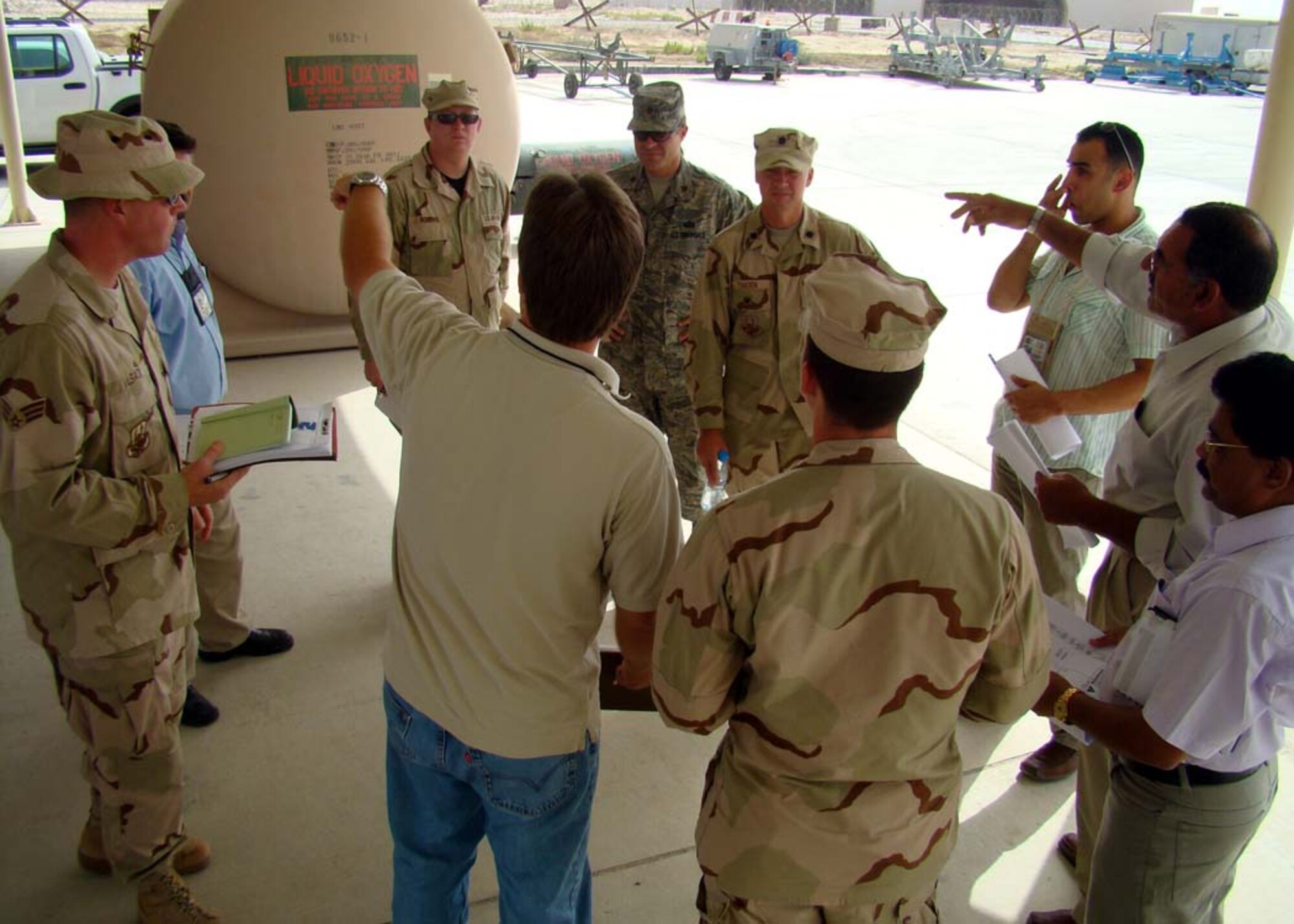 SOUTHWEST ASIA -- Representatives from the 380th Expeditionary Mission Support Group, Contracting Squadron, Civil Engineer Squadron and the U.S. government-contracted design team met with local contractors for a site survey of a new construction project intended to house liquid and gas oxygen. (U.S. Air Force photo/Tech. Sgt. Denise Johnson)(released)
                            