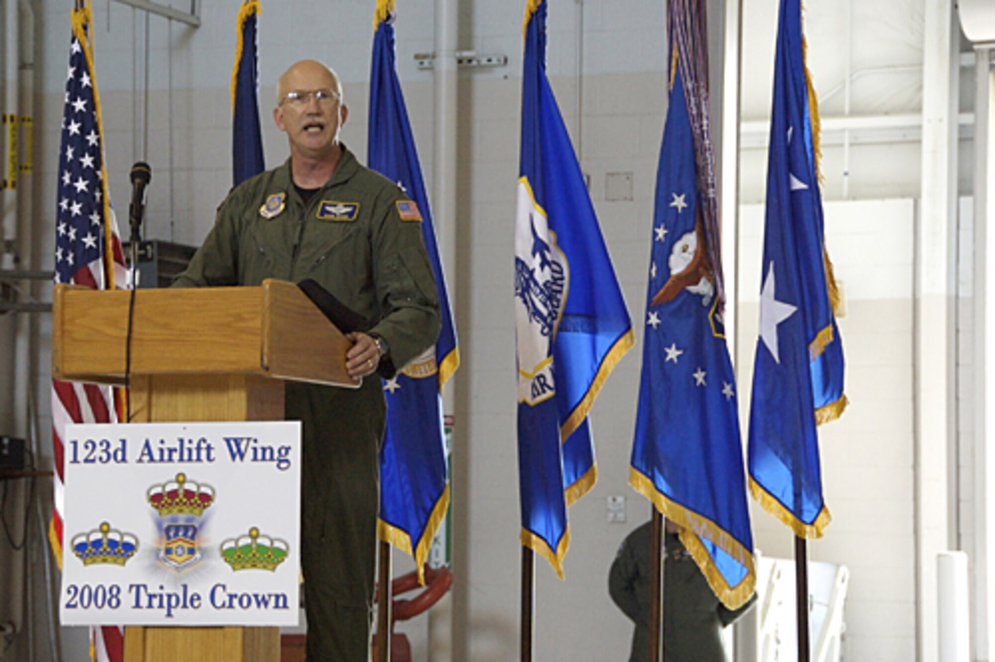 Col. Mark Kraus, commander of the 123rd Airlift Wing, praised unit members for their dedication to excellence during a commander’s call June 8 in the base Fuel Cell Hangar. (Capt. Dale Greer/KyANG)