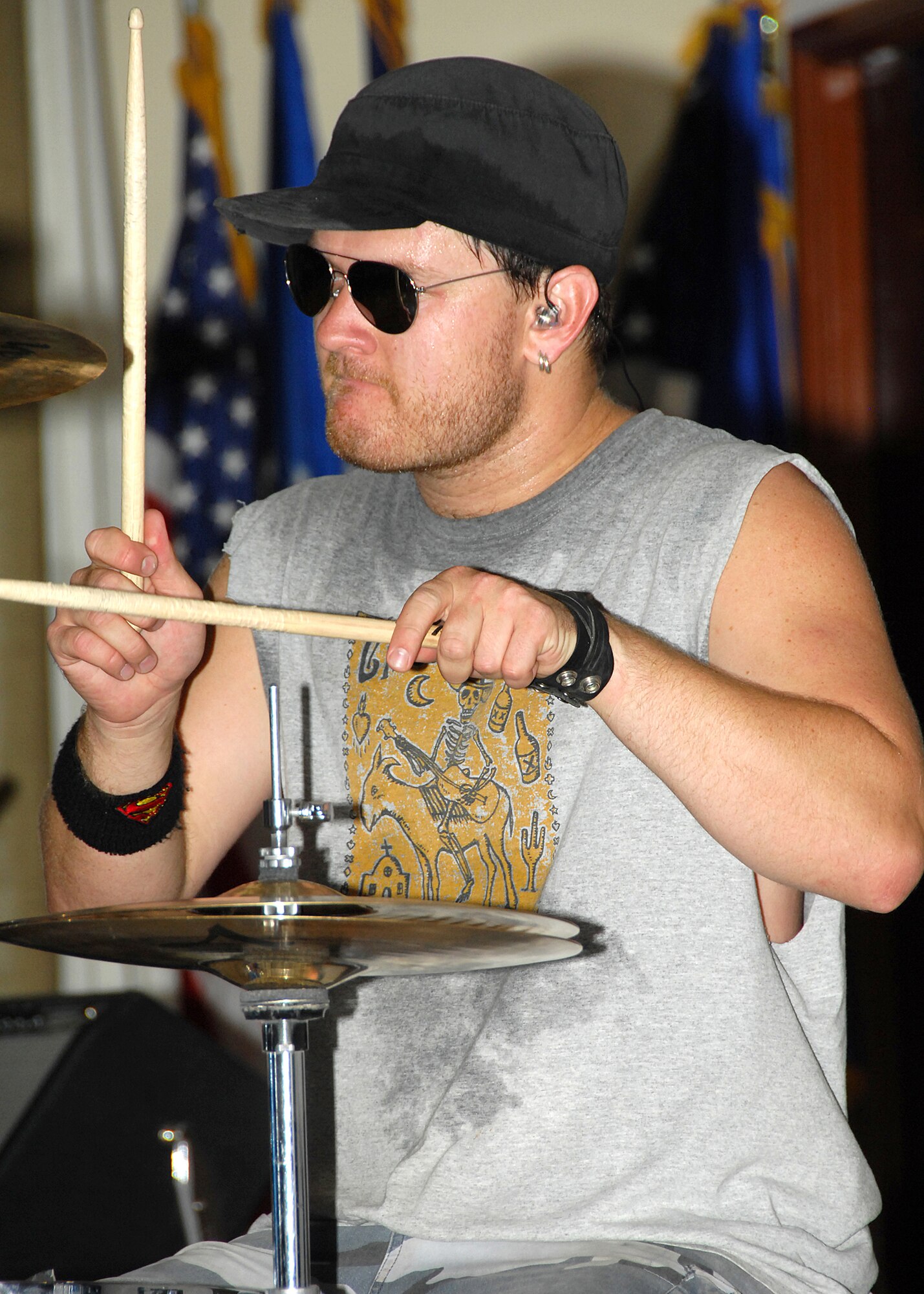 SOUTHWEST ASIA -- Scott Wittenberg, drummer for the band Beautiful Generation, puts on an energetic rock show on Aug. 8 at a base in Southwest Asia. This was the first stop on the band?s Operation Enduring Freedom Tour, which is sponsored by the United Service Organizations. The tour will take them to Iraq, Italy and Germany to entertain military members serving overseas. (U.S. Air Force photo/Tech. Sgt. Raheem Moore)