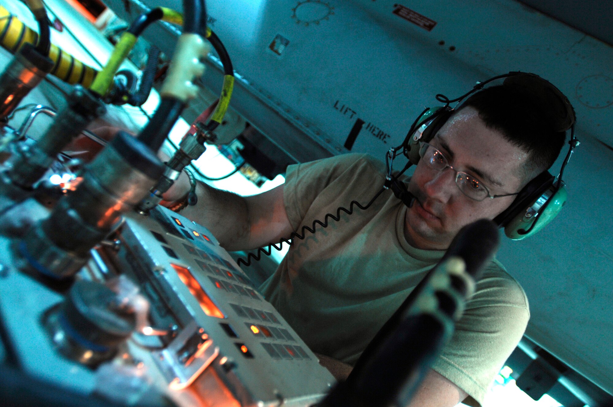 JOINT BASE BALAD, Iraq -- Staff Sgt. William Houston uses a 501 tester to check for a proper signal between a newly installed wing weapons pylon and an F-16 Fighting Falcon's computer. Communication between the aircraft's computer and weapons pylon allows the pilot to accurately deploy the proper weapon to complete the mission. Sergeant Houston, a weapons crewmember with the 332nd Expeditionary Aircraft Maintenance Squadron here, is deployed from Hill Air Force Base, Utah. (U.S. Air Force photo/Airman 1st Class Jason Epley)