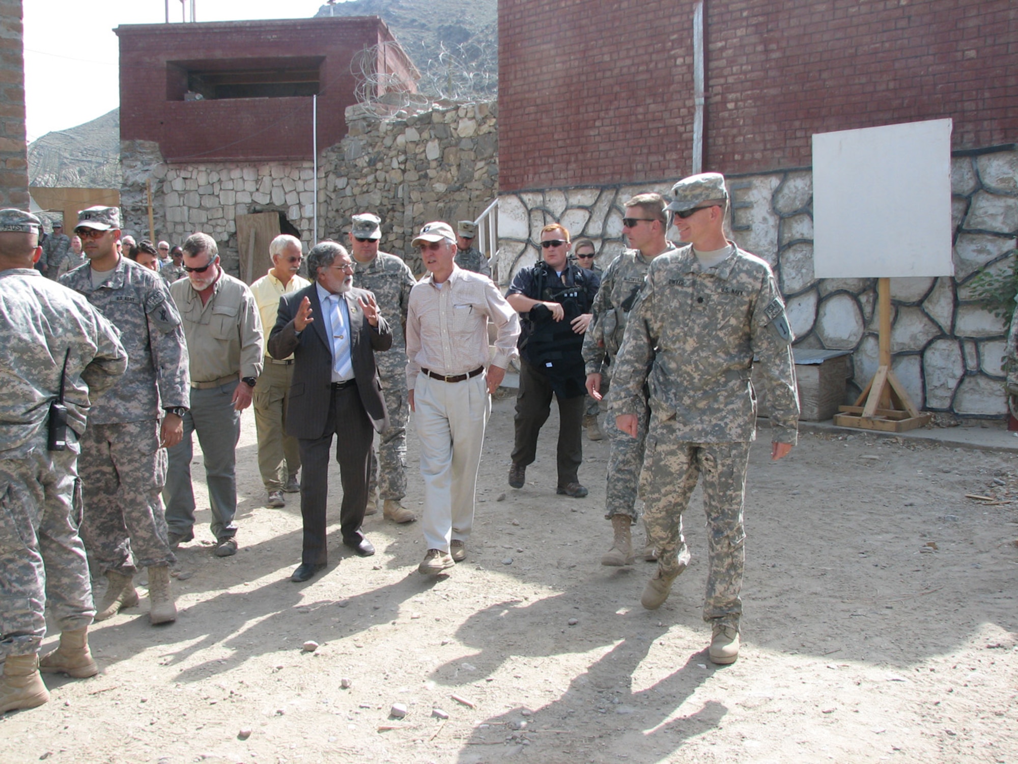 The Deputy Secretary of Defense, Gordon R. England, and Gov. Sayeed Wahid, Konar province’s governor, discuss how a strong Coalition partnership with the provincial government and a focus on large-scale infra-structure projects are key to the counterinsurgency efforts. England also visited with service members on Camp Wright, Afghanistan, during his visit, Aug. 7. (Courtesy photo)