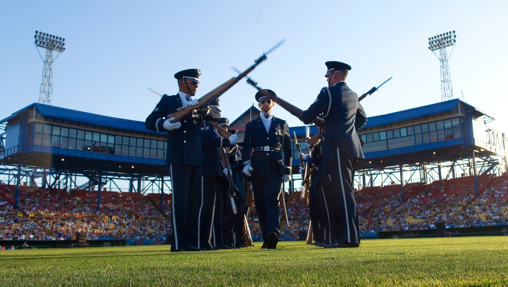 The Air Force Honor Guard drill team performs for approximately 10,000 spectators during the opening ceremonies of Air Force Week in the Heartland Aug. 9 at Rosenblatt Stadium in Omaha, Neb. The week is designed to broaden awareness of the Air Force's role in the war on terrorism and strengthen support for Airmen serving worldwide in defense of freedom. (U.S. Air Force photo/Staff Sgt. Bennie J. Davis III)