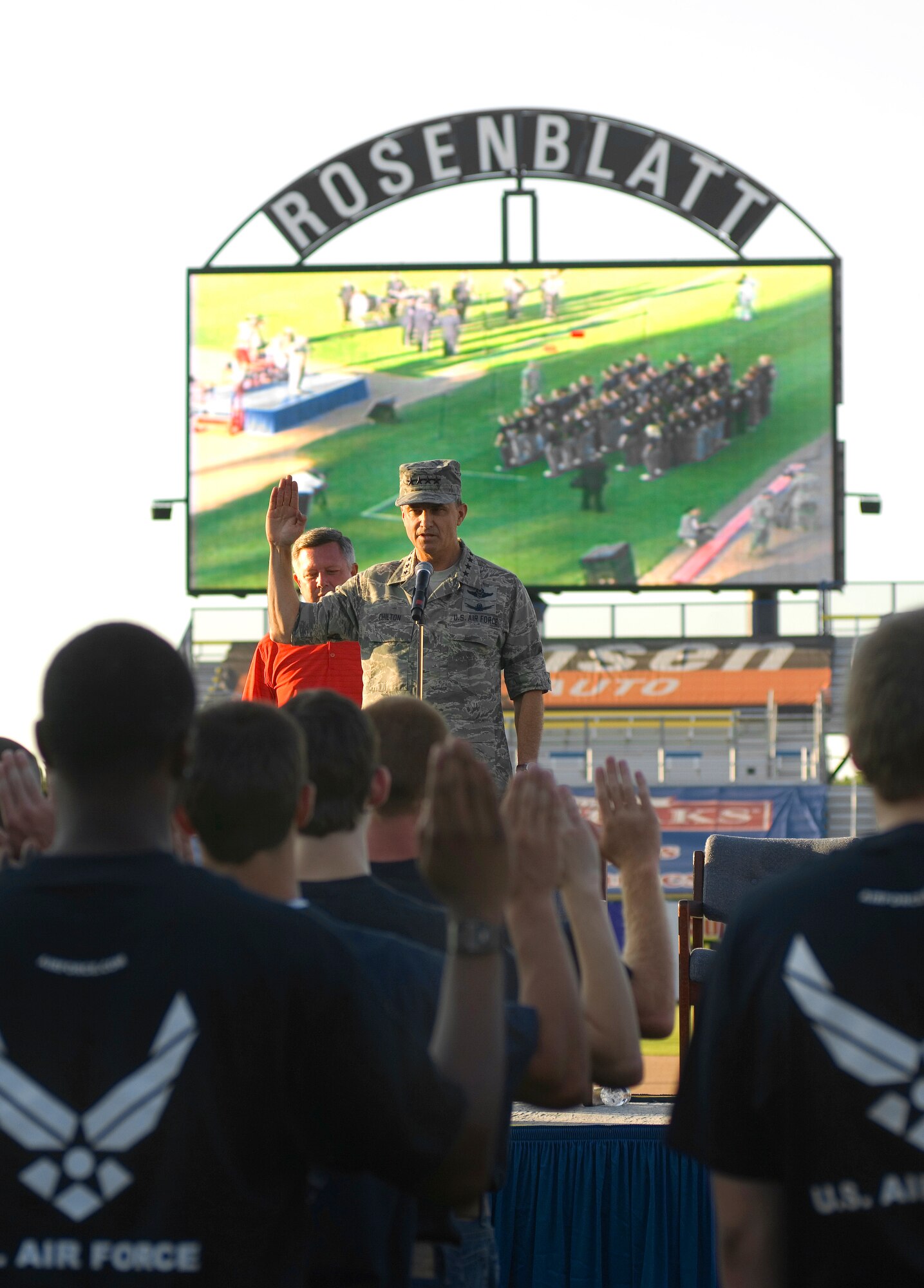 Gen. Kevin P. Chilton administers the oath of enlistment to approximately 50 new recruits during a proclamation ceremony as part of Air Force Week in the Heartland Aug. 9 at Rosenblatt Stadium in Omaha, Neb. The week is designed to broaden awareness of the Air Force's role in the war on terrorism and strengthen support for Airmen serving worldwide in defense of freedom. General Chilton is the commander of U.S. Strategic Command at Offutt Air Force Base, Neb. (U.S. Air Force photo/Staff Sgt. Bennie J. Davis III)