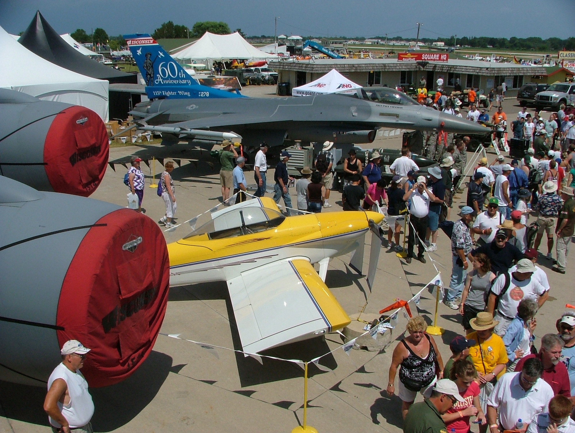 An experimental RV-4 plane and an Air Force F-16 Fighting Falcon, as well as six other Air Force aircraft, are on display at the Experimental Aircraft Association Air Venture Oshkosh airshow in Oshkosh, Wisconsin where more than 540,000 civilians and military pilots from around the globe gathered July 31-Aug. 3  to showcase their planes and to compete for awards that recognize the best of the best.  Lt. Col. Linch, the 12th Air Force (Air Forces Southern) chief of flight safety attended the airshow to educate general aviation and civilian pilots on midair collision avoidance and on the need for flight safety and planning awareness. 