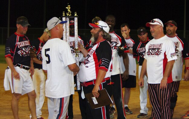 Master Sgt. Robbie Robinson from the 601st Air and Space Operations Center presented Team Georgia with the open championship trophey for this years 43rd Annual Air National Guard Softball Tournament. Photo taken by Mr. Cliff Fallico.