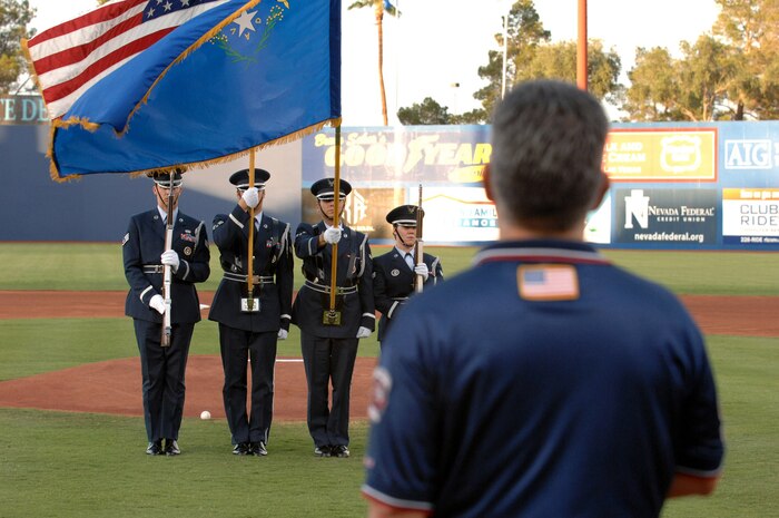 Members of the Nellis Air Force Base Honor Guard Present the Colors before the Las Vegas 51s vs. Sacramento River Cats game at Cashman Field on Aug. 8, 2008, LAs Vegas. More than 400 tickets were donated to Nellis and Creech Air Force Bases for the friday game.
(U.S. Air Force photo / Airman First Class Brett C. Clashman, RELEASED)