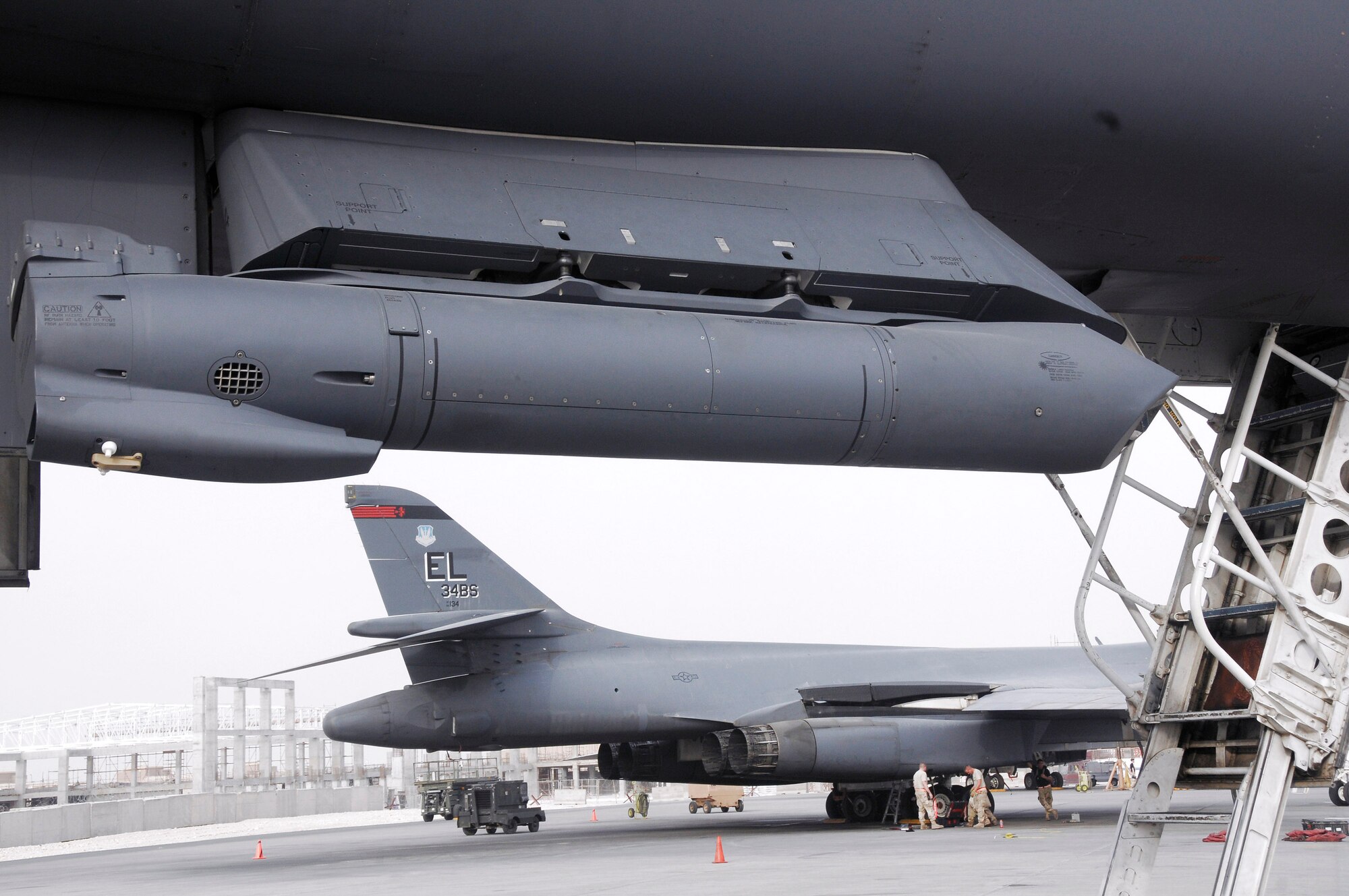 A Sniper Advanced Targeting Pod hangs from the underbelly of a B-1B Lancer after a recent mission in Southwest Asia Aug. 5. The Sniper ATP provides enhanced target identification for aircrew, allowing them to detect and analyze targets on the ground via real-time imagery. (U.S. Air Force photo/Staff Sgt. Darnell Cannady) 
