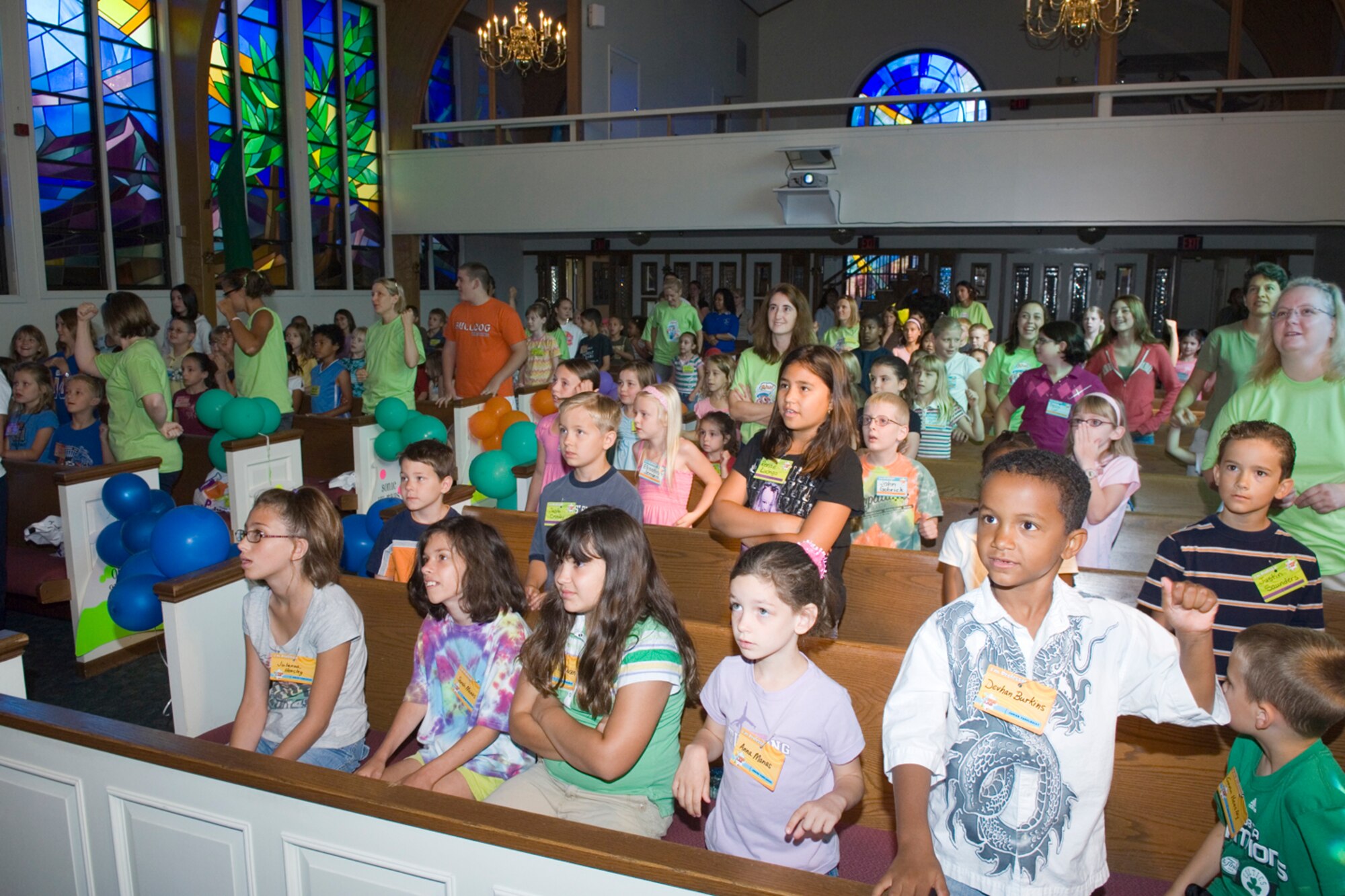 HANSCOM AFB, Mass. – Participants in this year’s Vacation Bible School take part in a group activity inside the Chapel on Aug. 4. Vacation Bible School took place from Aug. 4 to 8, approximately 140 children and 59 adults volunteered to help with the week-long activities. (U.S. Air Force photo by Rick Berry)