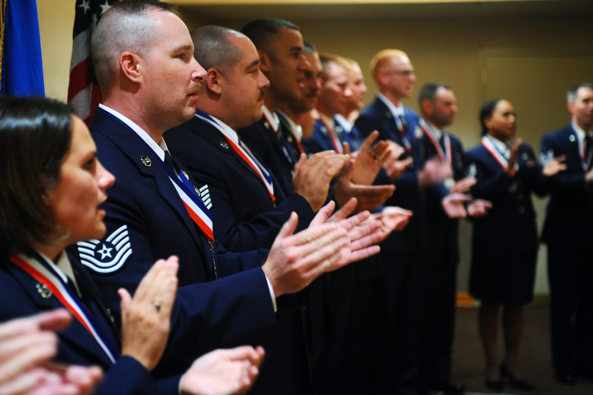 Senior Non-Commissioned Officers inductees sing the Air Force song ending the SNCO induction ceremony Aug. 1, 2008 at Eielson Air Force Base, Alaska. The SNCO Induction ceremony is held to recognize individuals who progresses through the ranks and have been selected for master sergeant promotion transitioning them to senior leadership level with more responsibility. (U.S. Air Force photo by Airman 1st Class Jonathan Snyder)