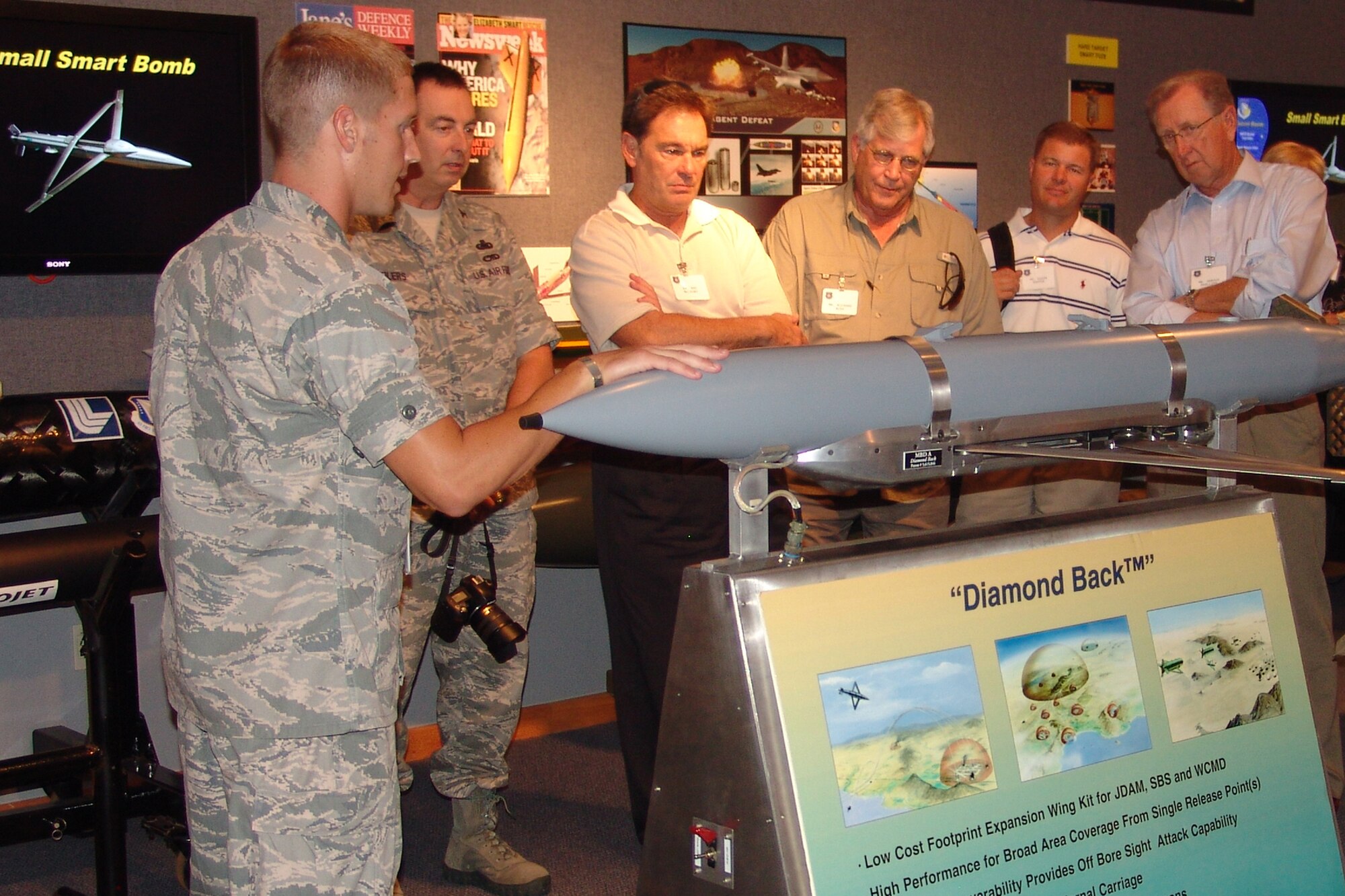 2nd Lt. Mitchell Kieffer briefs Tinker AFB civic leaders on the latest technology at the Air Force Research Laboratory.  The guests are members of Tinker AFB's Community Star program who visited the base with their respective Tinker leadership. (USAF photo by Chrissy Cuttita)