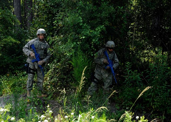 MOODY AIR FORCE BASE, Ga. -- Staff Sgts. Gary Hilliard and Jeremiah Dupriest, both 823rd Security Forces Squadron, sweep the area for improvised explosive devices during an exercise here July 25. The 823rd SFS members are part of the 93rd Air Ground Operations Wing which is a tenant unit here. The unit was participating in IED sweep training to increase readiness for future deployments. (U.S. Air Force photo by Airman 1st Class Brittany Barker