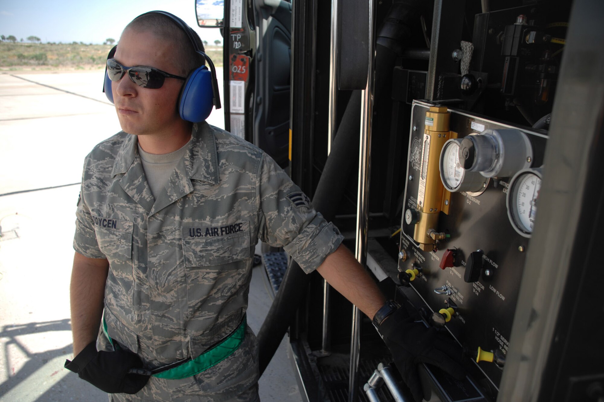 Senior Airman Kurtis Toycen, a fuels specialist with the 49th Logistics Readiness Squadron at Holloman Air Force Base, N.M., operates a fuel truck control panel July 23 during the hot refueling of an F-22 Raptor.  Hot refueling is a procedure used to refuel an aircraft while the engines are still running, cutting the time needed to refuel in more than half. (U.S. Air Force photo/Airman 1st Class Jamal D. Sutter)