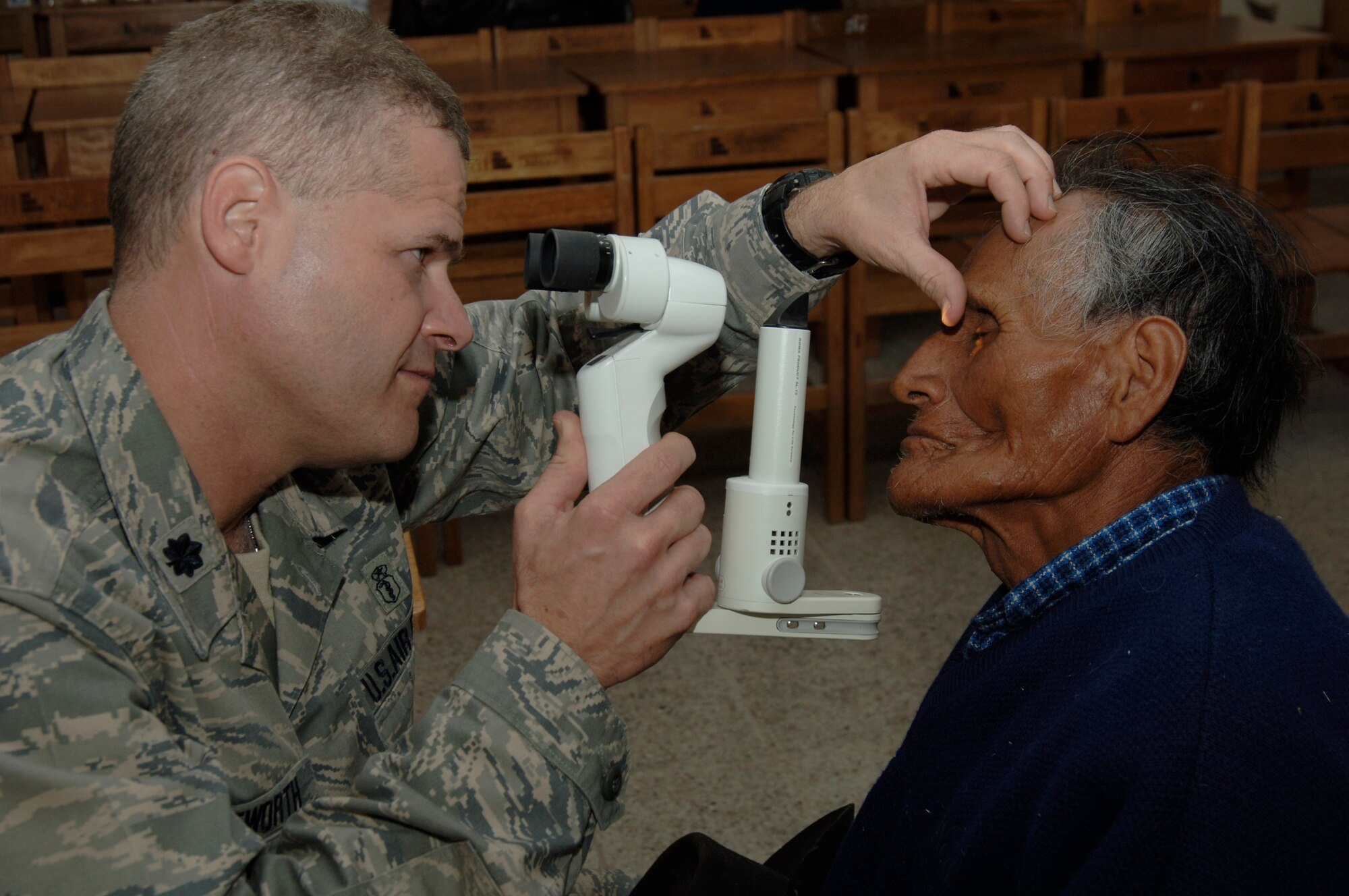 Dr. (Lt. Col.) Gregg Wentworth, an optometrist from the 433rd Medical Group at Lackland AFB, Texas, performs an eye exam on a Peruvian man during a medical mission in Quinua, Peru, Aug. 7.  A team of 19 Air Force reservists deployed to Ayacucho, Peru to perform the last three medical missions supporting New Horizons - Peru 2008, a U.S. and Peruvian effort to bring relief to underpriviliged Peruvians. (U.S. Air Force photo/1st Lt. Mary Pekas)