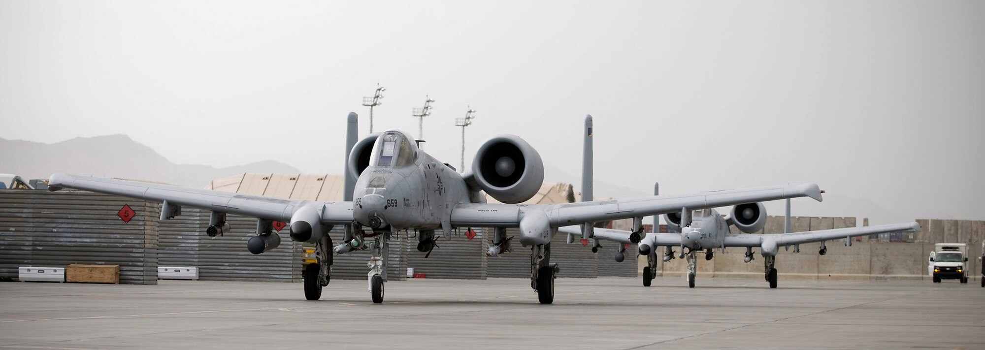 Two A-10 Thunderbolt II jets taxi out to the runway July 26 at Bagram Airfield, Afghanistan.  The jets are experts at close air support missions and have proven to be invaluable despite being well past their expected useful lifespan. (U.S. Air Force photo/Staff Sgt. Samuel Morse) 