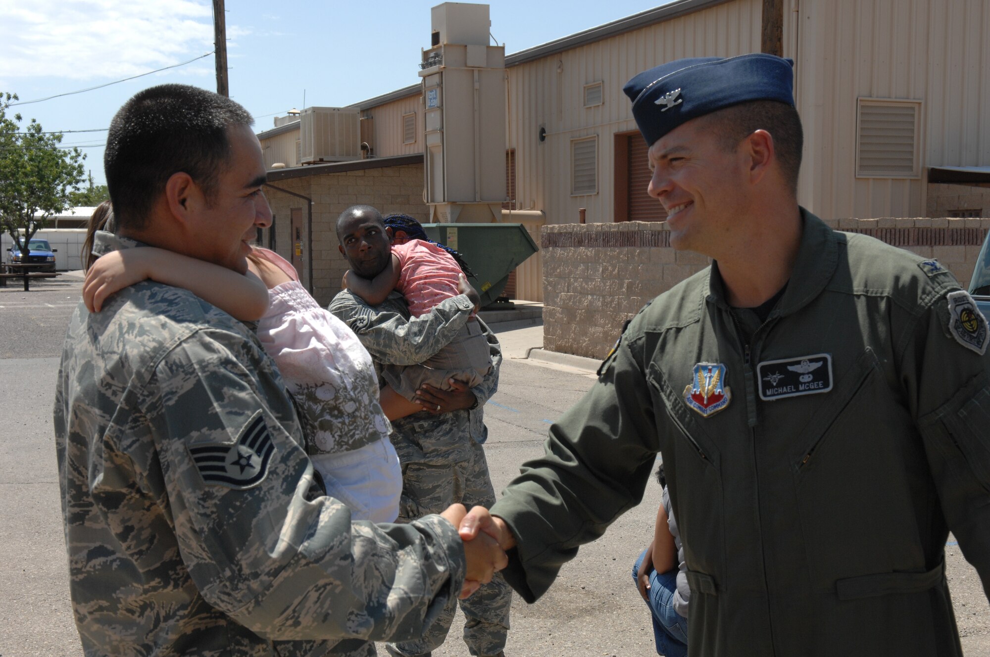 Staff Sgt. Jason Cordero, 49th Civil Engineer Squadron, is greeted by Col. Michael McGee, 49th Fighter Wing vice commander, Aug. 6 at Holloman Air Force Base, N.M.,
after returning home from a four month deployment. While deployed, the team moved 700,000 feet of rubber to six locations in three different countries to include Iraq and Afghanistan. (U.S. Air Force photo/Senior Airman Anthony Nelson Jr)

