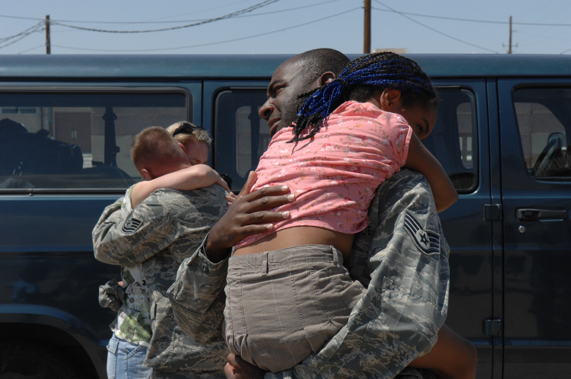 Members of the 49th Civil Engineer Squadron, are greeted by their family members Aug. 6 at Holloman Air Force Base, N.M., after returning home from a four month deployment. While deployed, the team moved 700,000 feet of rubber to six locations in three different countries to include Iraq and Afghanistan. (U.S. Air Force photo/Senior Airman Anthony Nelson Jr)