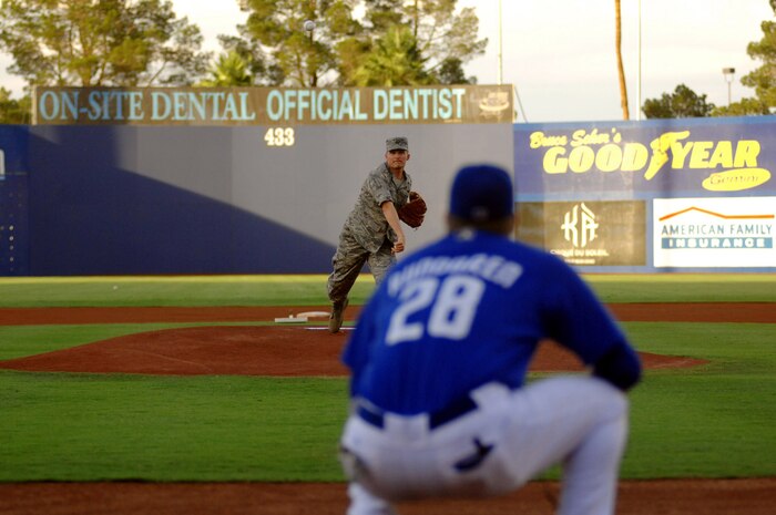 Col. David Belote, 99 Air Base Wing commander, throws out the first pitch before the Las Vegas 51s vs. Sacramento River Cats game at Cashman Field, Las Vegas, Aug. 8, 2008.  More than 400 tickets were donated to Nellis and Creech Air Force Bases for the Friday night game.
(U.S. Air Force photo / Senior Airman Jason R. Huddleston)