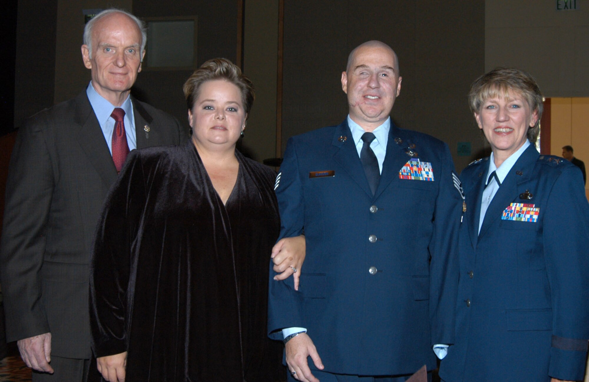 Mr. Art Myers, Air Force Services director, Mrs. Annette Slaydon, wife of Staff Sgt. Matt Slaydon, Air Force Wounded Warrior special guest speaker, and Maj. Gen. K.C. McClain, Air Force Personnel Center commander, stand for a photo at the 2008 Manpower, Personnel and Services Worldwide Conference in Keystone, Colo.. 