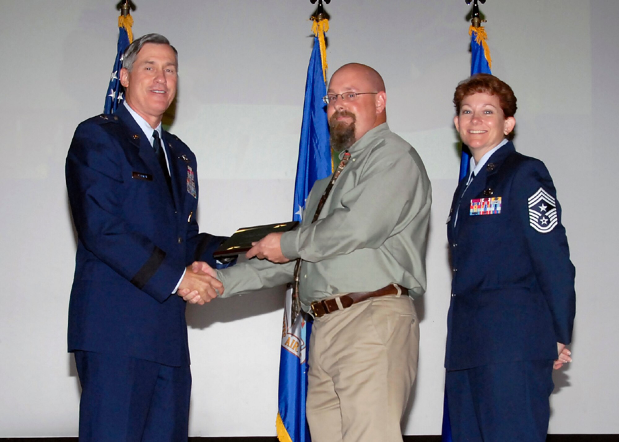 Brig. Gen. O.G. Mannon, 82nd Training Wing commander, presents Eddie Jordan, 362nd Training Squadron, with the Civilian Instructor of the Quarter award Aug. 08. (U.S. Air Force photo/Mike Litteken) 