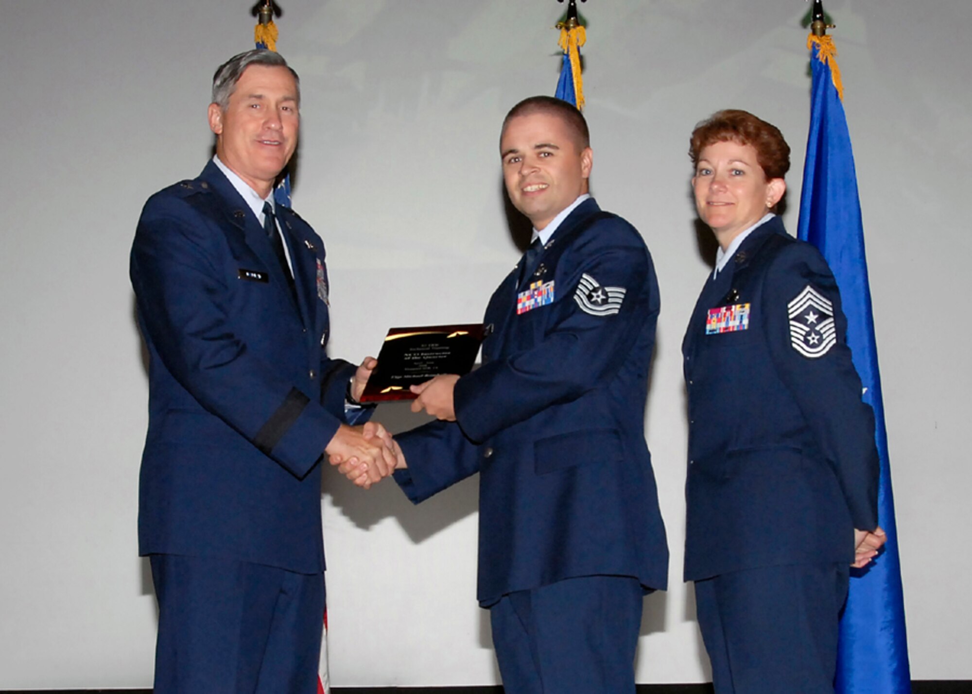Brig. Gen. O.G. Mannon, 82nd Training Wing commander, presents Tech. Michael Brimhall, 366th Training Squadron, with the NCO Instructor of the Quarter award Aug. 08. (U.S. Air Force photo/Mike Litteken) 