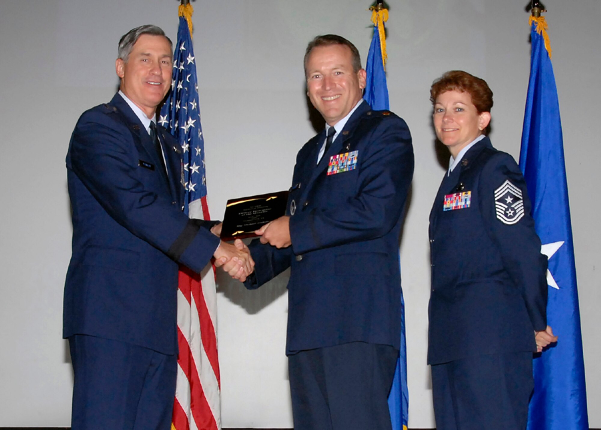 Brig. Gen. O.G. Mannon, 82nd Training Wing commander, presents Maj. Michael Arnholtz, 381st Training Squadron, with the Officer Instructor of the Quarter award Aug. 08. (U.S. Air Force photo/Mike Litteken) 