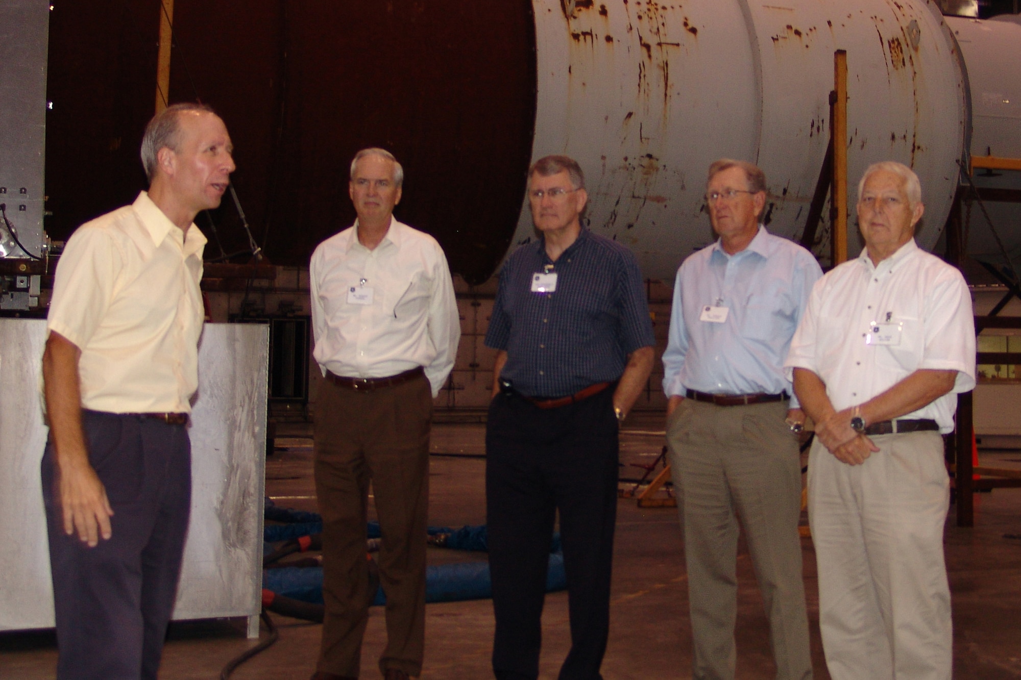 Mr. Kirk Velasco (left) explains the capability of the Climatic Lab to Oklahoma City civic leaders during their tour of Eglin AFB Aug. 8. The guests are members of Tinker AFB's Community Star program who visited the base with their respective Tinker leadership.  (USAF photo by Chrissy Cuttita)                            
