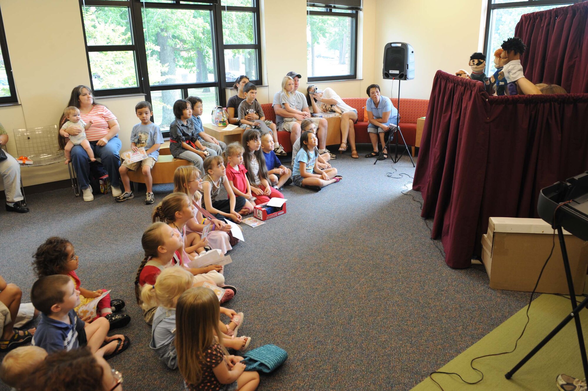 SHAW AIR FORCE BASE, S.C. -- Children watch a puppet show as part of culmination of the summer reading program sponsored by the base library August 8. The group of military dependents amassed a combined total of more than 500 reading hours during the program. (U.S. Air Force photo/Staff Sgt. Henry Hoegen)