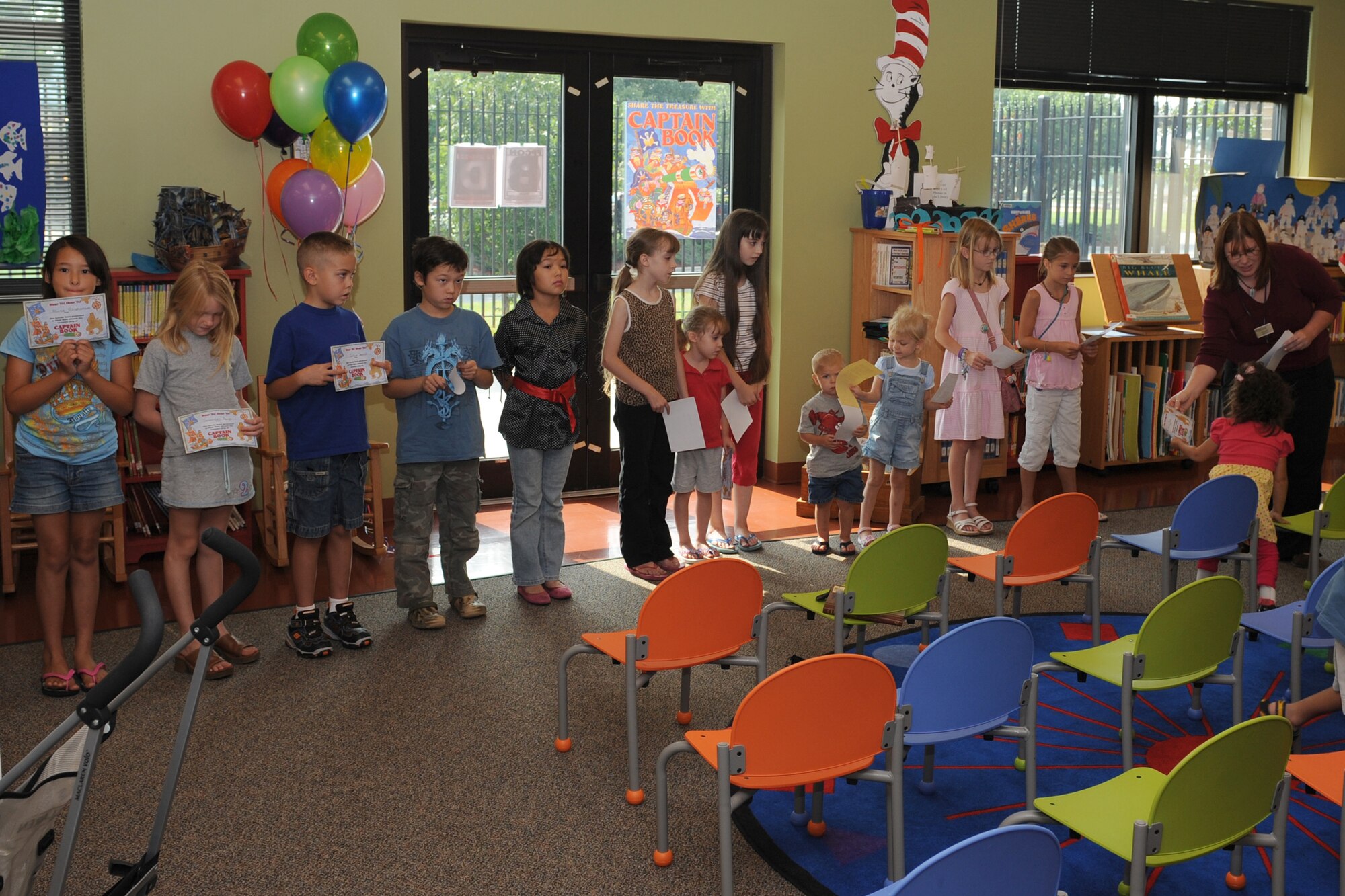 SHAW AIR FORCE BASE, S.C. -- Children stand in line to receive certificates for completing the summer reading program sponsored by the base library August 8. The group of military dependents amassed a combined total of more than 500 reading hours during the program. (U.S. Air Force photo/Staff Sgt. Henry Hoegen)