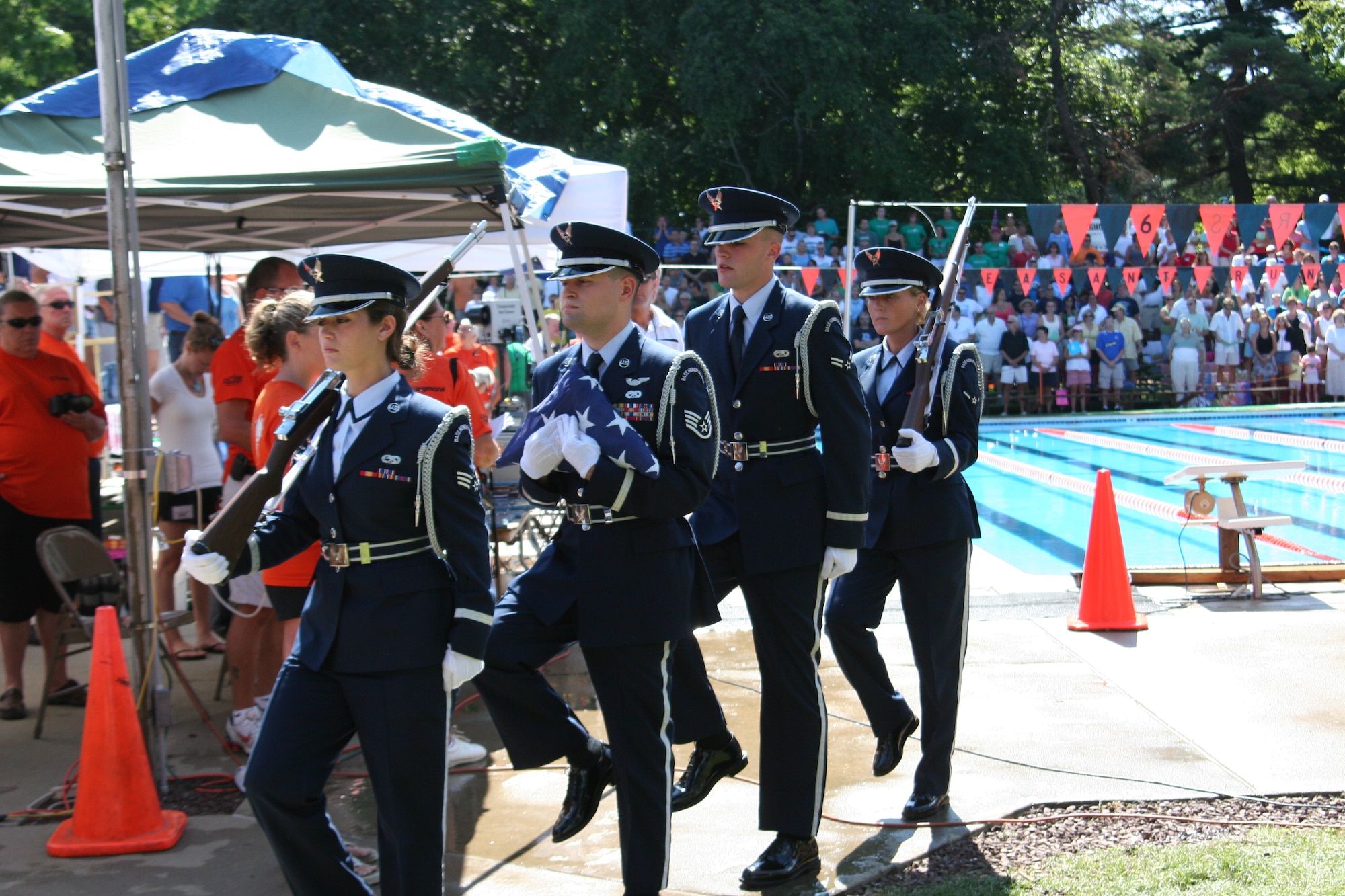 McGuire Air Force Base Honor Guard members raise the U.S. flag prior to the Tri-County Swimming Pool Association Championships Aug. 3 at Pheasant Run Swim Club, in Cinnaminson, N.J. The McGuire AFB Honor Guard is an elite group of Air Force men and women, whose primary mission is the rendering of honors at military funerals.  If schedules permit, the Honor Guard participates in community events, including patriotic ceremonies, parades, school flag presentations and sporting events.

For more information or to request the Honor Guard, call (609) 754-4117 no later than four weeks prior to the date of the event. (U.S. Air Force photo/Civil Air Patrol 1st Lt. Mark Swanson)
