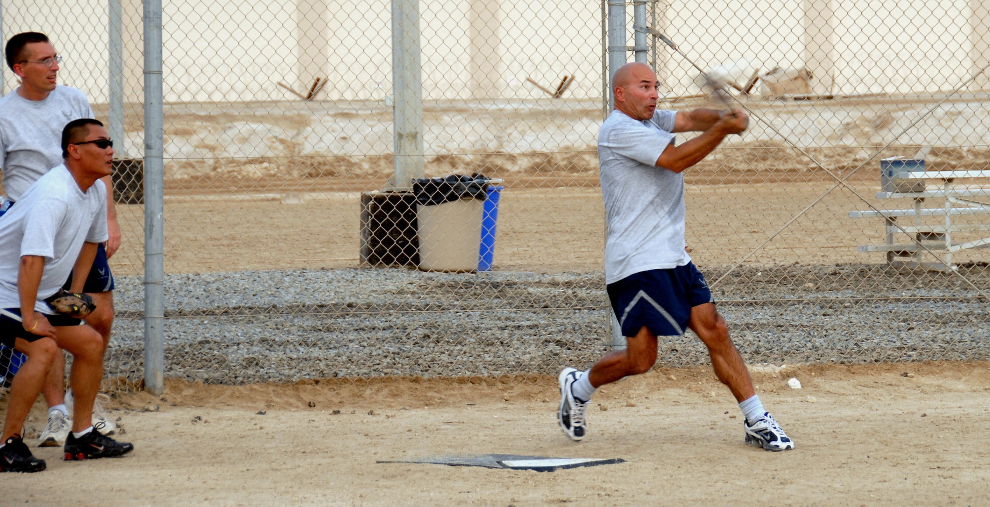 SOUTHWEST ASIA -- Over 40 left fielder, Kevin Shavnore, shows great form with a perfect turn into the hit as he drives one deep for an in-the-park homerun.  (U.S. Air Force photo/Tech. Sgt. Denise Johnson)(released)