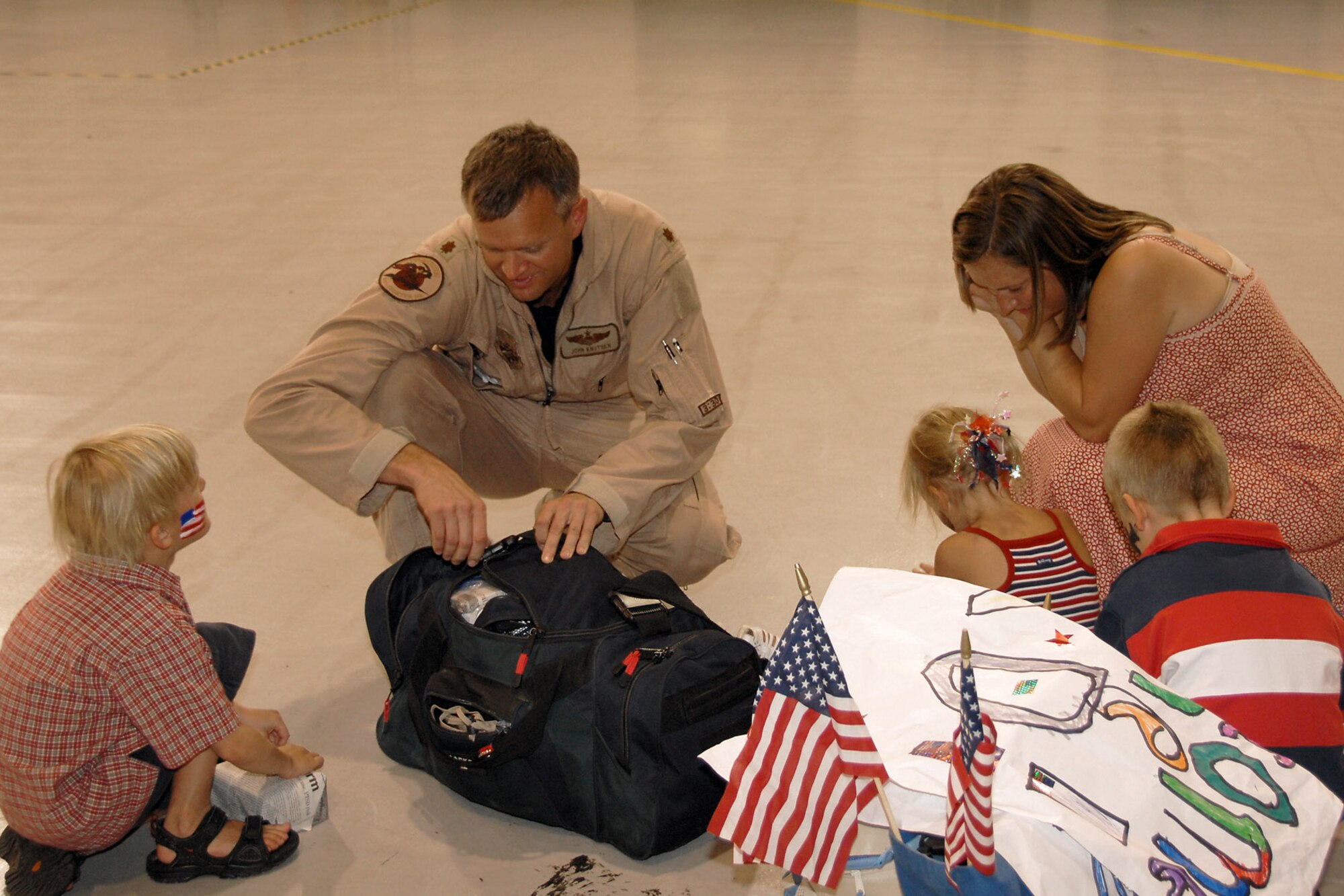 Maj. John Knutsen, with the 174th Fighter Wing at Hancock Field, N.Y., searches his bag for souvenirs for his family after returning home Aug. 5 from Southwest Asia in support of Operation Iraqi Freedom.  (U.S. Air Force photo/Tech. Sgt. Jeremy M. Call) 