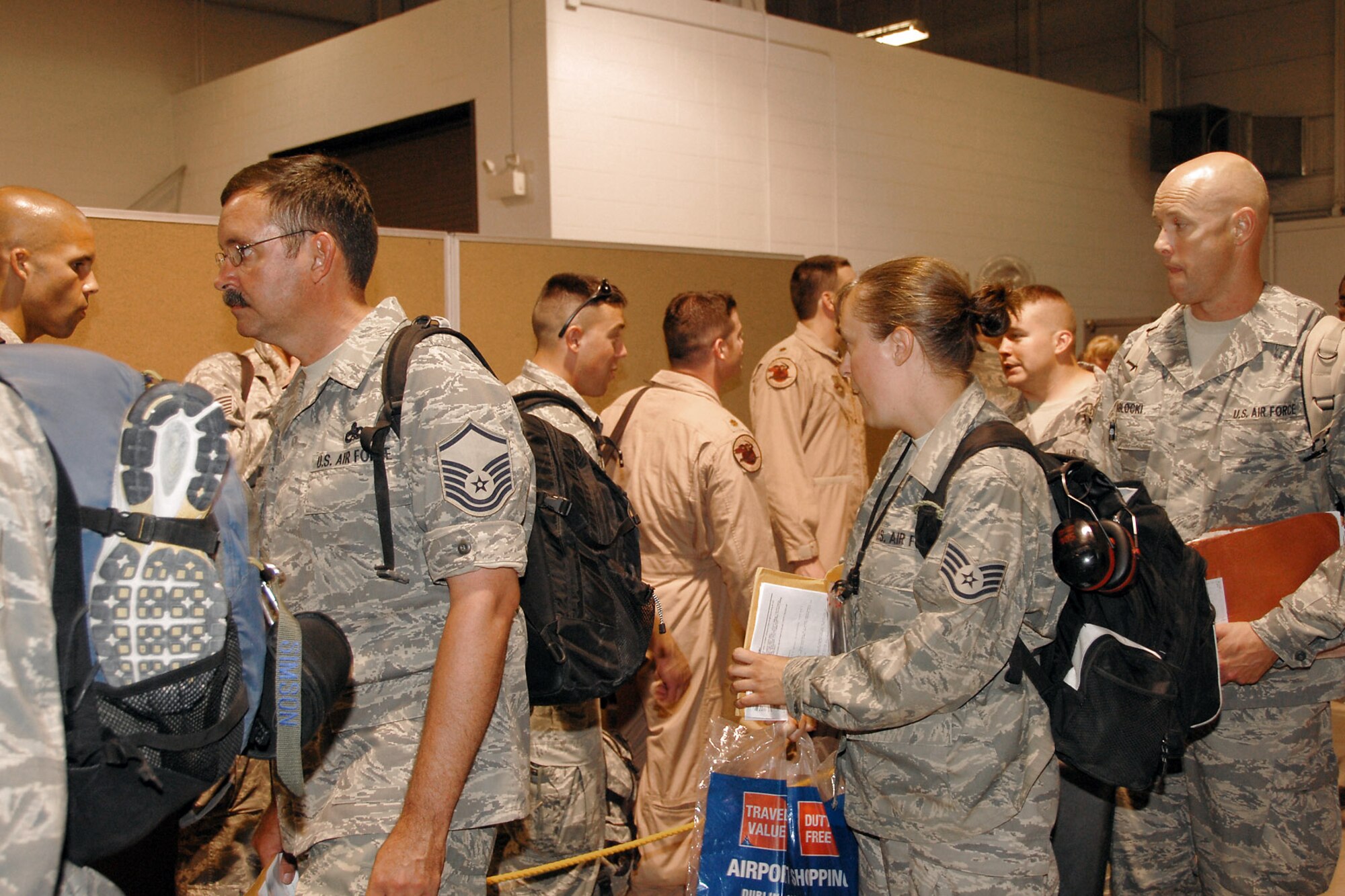 Airmen from the 174th Fighter Wing at Hancock Field, N.Y., move through the processing line after returning home Aug. 5 from a deployment to Southwest Asia in support of Operation Iraqi Freedom.  (U.S. Air Force photo/Tech. Sgt. Jeremy M. Call) 