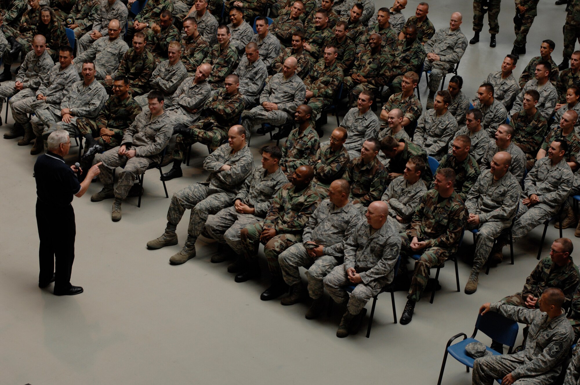 Retired Chief Master Sgt. of the Air Force Robert D. Gaylor speaks to hundreds of Airmen in the 1st Combat Communications Squadron, Aug. 8, 2008, Ramstein Air Base, Germany.  Chief Gaylor is known for his motivational speeches.  He travelled to Avaino Air Base, Italy and Spangdahlem Air Base, Germany as well to speak to a hundred more Airmen.  (U.S. Air Force photo by Senior Airman Amber Bressler)(Released)