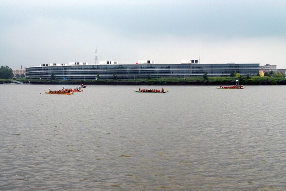 The 180th Fighter Wing Team crosses the finish line of the first race in second place at the 2008 Dragon Boat Festival on the Maumee River in downtown Toledo, Ohio on July 26. The Great Maumee River Dragon Boat Festival raises funds to support the mission of Partners In Education of Toledo. USAF photo by SrA Sheena Meyer (Released).