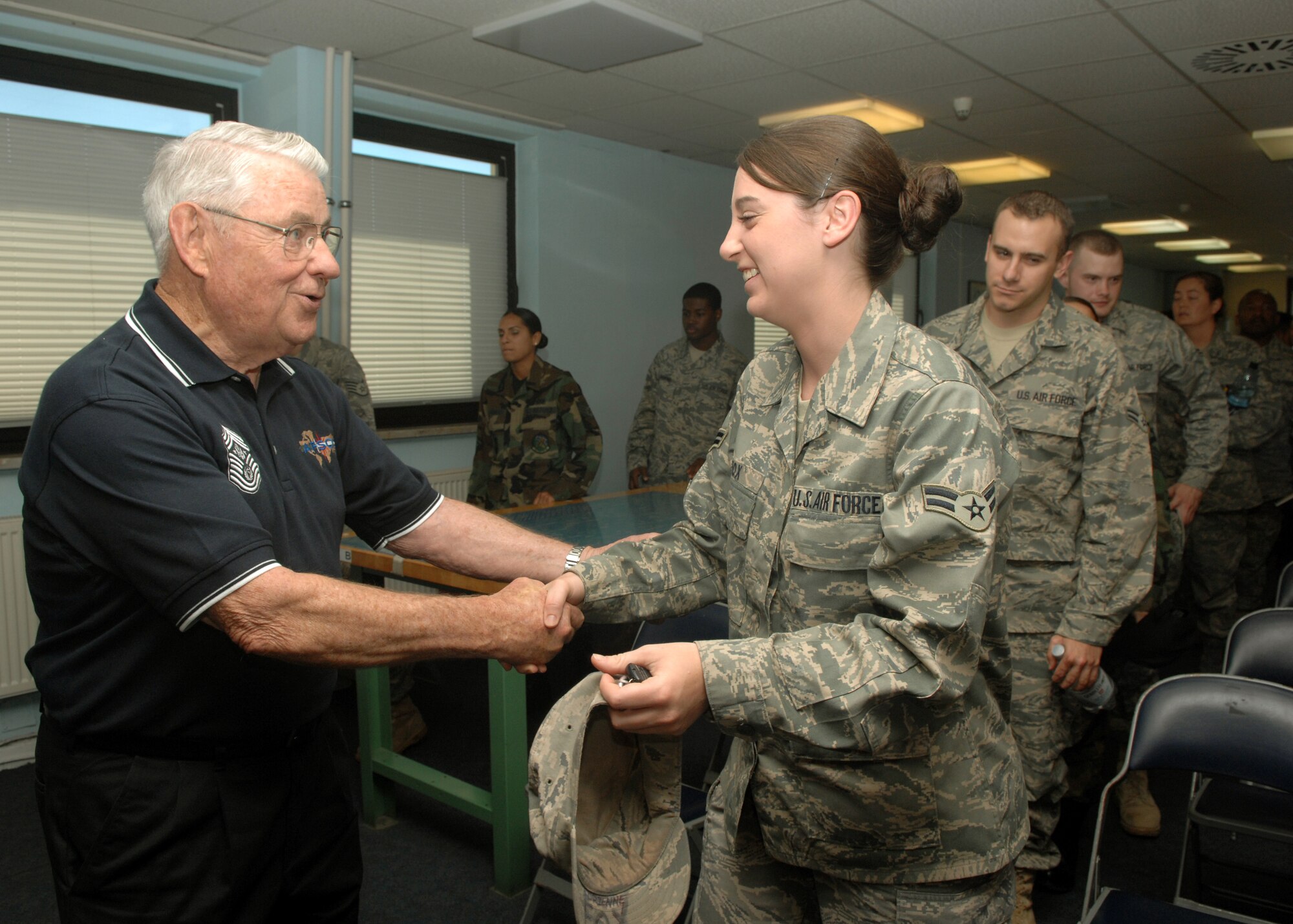 SPANGDAHLEM AIR BASE, Germany – Airman 1st Class Adrienne Fox, 52nd Operations Group, shakes hands with Robert D. Gaylor, 5th Chief Master Sgt. of the Air Force, Aug. 6, 2008. Spangdahlem is the 20th base Chief Gaylor visited this year.  (U.S. Air Force photo by Airman Staci Miller)