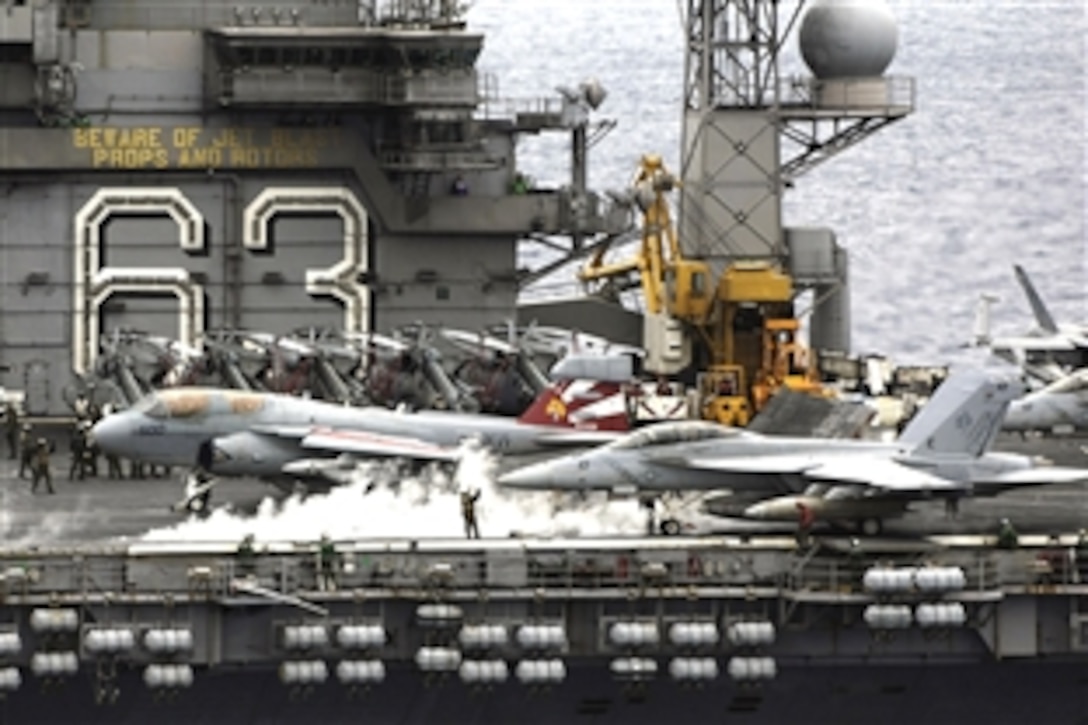 An EA-6B Prowler aircraft and an F/A-18F Super Hornet aircraft prepare for their last launch from the flight deck of the USS Kitty Hawk while under way in the Pacific Ocean, Aug. 6, 2008. The aircraft departed to join the USS George Washington in San Diego, Calif. The USS Kitty Hawk is returning to the United States to be decommissioned after 46 years of service. 