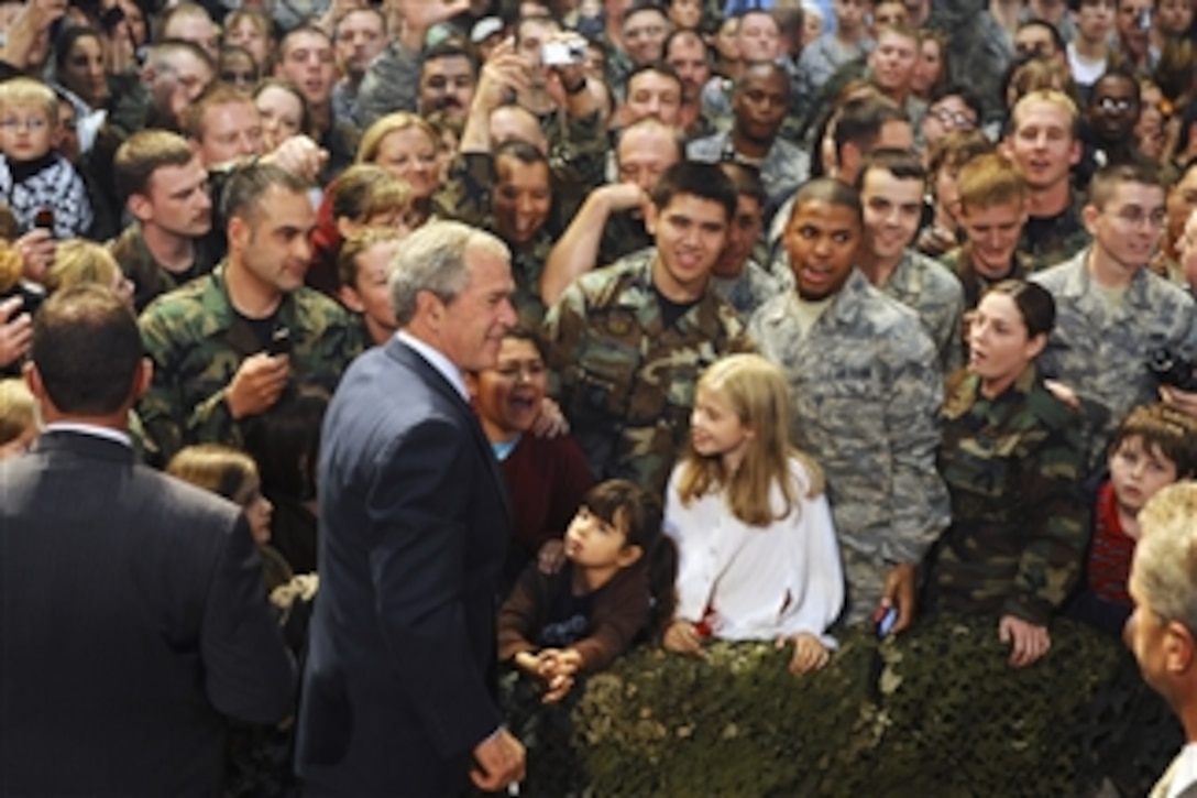 President George W. Bush meets with U.S. service members at Eielson Air Force Base, Alaska, on Aug. 4, 2008.  Bush made a short stop at the base on his way to the 2008 Olympic Games in Beijing, China.  During his visit he spoke to a crowd of more than 2,000 military personnel and took time to personally greet and thank individual service members for their service.  