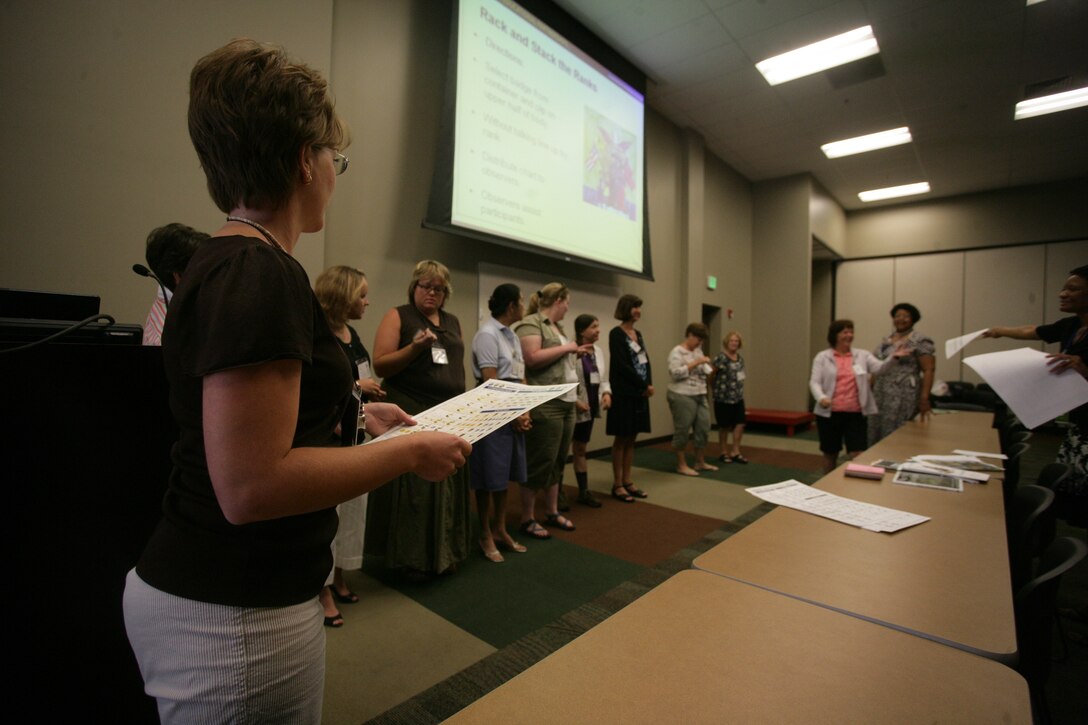 Nancy Lewis, assistant principle at La Contenta Middle School in Yucca Valley, Calif., takes part in a group activity during the Exploring Military Culture course August 12 at the Combat Center’s Building 1707. Lewis, a native of Woodstown, N.J., was taking part in the teacher to teacher workshops sponsored by the Department’s of Education and Defense Education Activity in collaboration with the Morongo Unified School District.