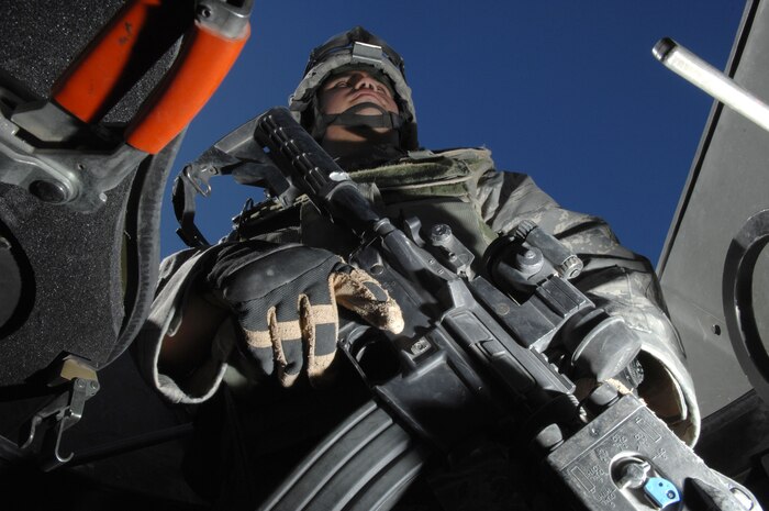 Airman 1st Class Jordan Gogov, 99th Security Forces Squadron, stands guard during convoy operations training at Creech Air Force Base, Nev. Aug. 11, 2008. The training is part of the 99th Security Forces Ground Combat Training Squadron's Joint Base Balad training curriculum, a new forty-five day training course designed for security forces personnel and chaplains to train to embed with the Army stationed there, and eventually take over all Army operations outside the wire at Joint Base Balad, Iraq. (U.S. Air Force Photo by Senior Airman Larry E. Reid Jr.) 