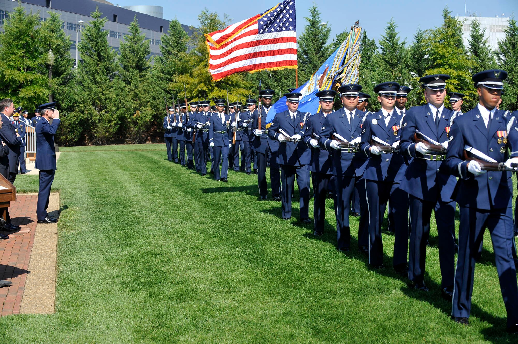 The United States Air Force Honor Guard passes in review as Gen. Norton A. Schwartz renders a salute during his welcoming ceremony Aug. 12 at Bolling Air Force Base, D.C.  General Schwartz is the 19th Air Force chief of staff.  (U.S. Air Force photo/Scott M. Ash) 
