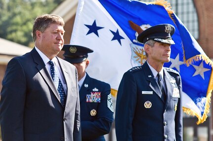 Acting Secretary of the Air Force Michael B. Donley prepares to pass the ceremonial Air Force flag to Gen. Norton A. Schwartz during a welcoming ceremony Aug. 12 at Bolling Air Force Base, D.C., in honor of General Schwartz.  The general is the 19th Air Force chief of staff.     (Defense Dept. photo/Cherie Cullen)