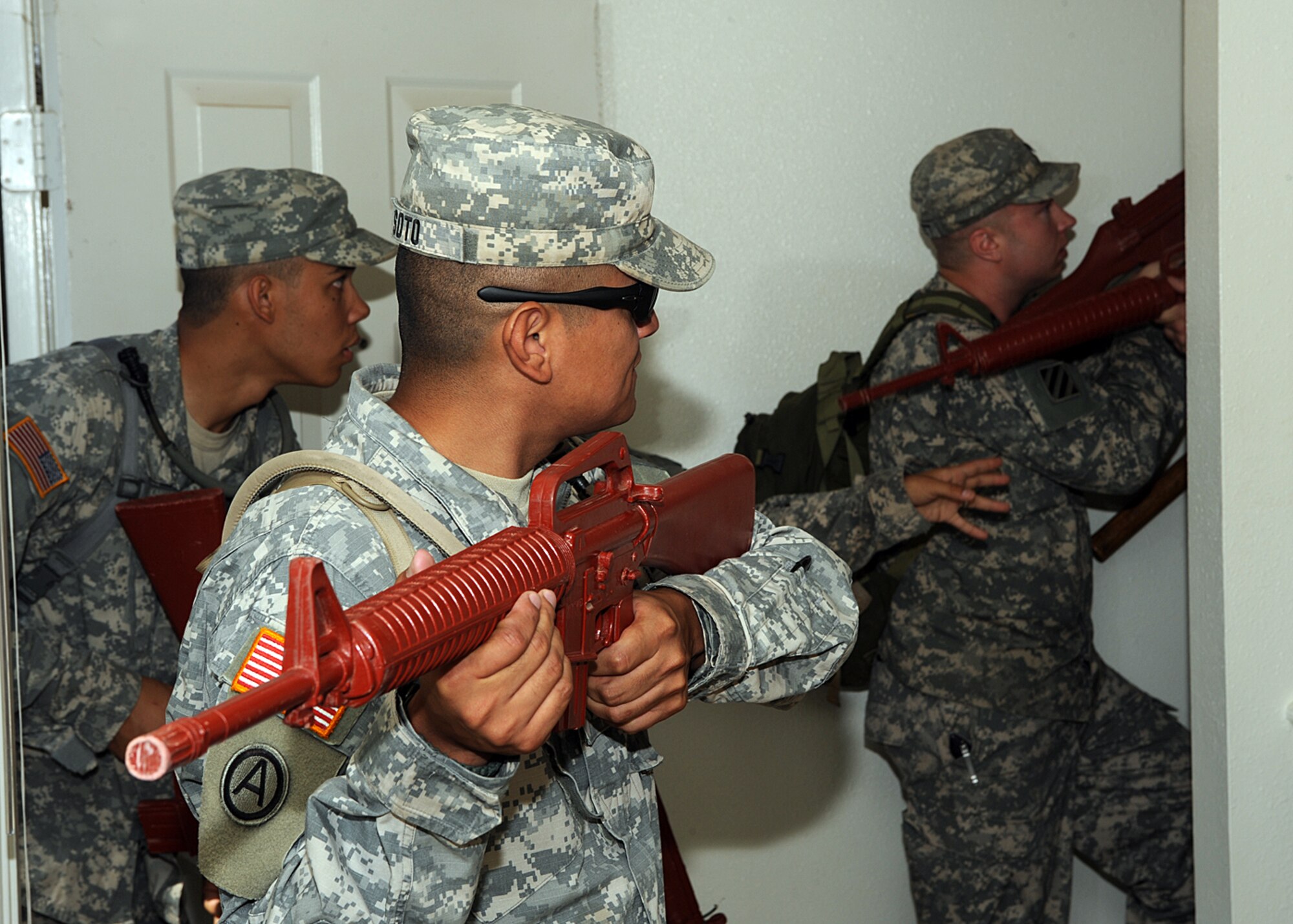 The Army National Guard, based out of Roswell and Alamogordo, N.M., practice clearing buildings in an old base housing unit at Holloman Air Force Base, N.M. The unit is preparing for upcoming live fire training and a pending deployment. (U.S Air Force photo/ Airman 1st Class DeAndre Curtiss) 