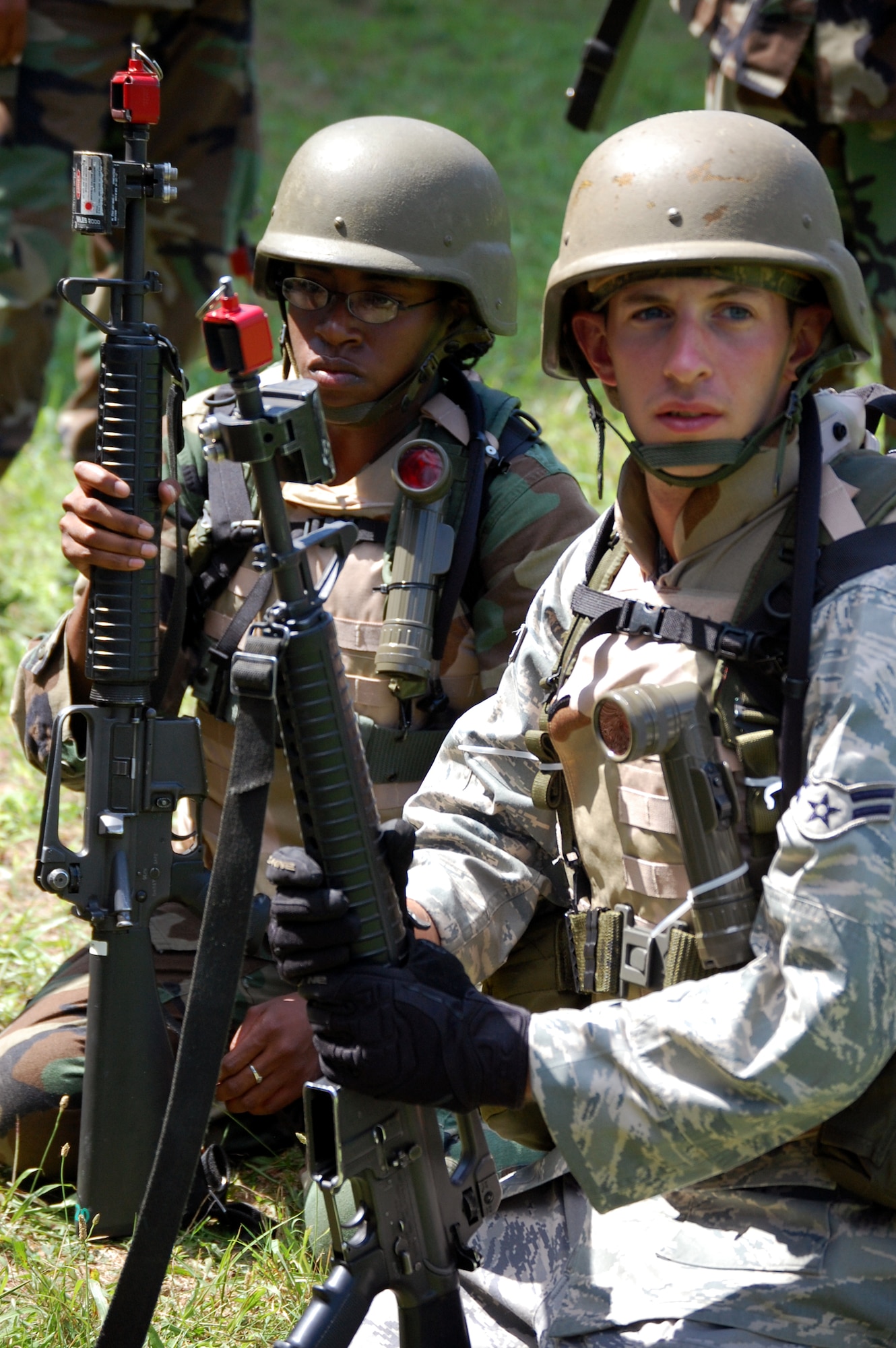 Students in the Advanced Contingency Skills Training Course listen to their instructor during patrolling and tactics training for the course Aug. 12, 2008, on a range on Fort Dix, N.J.  The course, taught by the U.S. Air Force Expeditionary Center's 421st Combat Training Squadron, prepares Airmen from multiple career fields for upcoming deployments.  (U.S. Air Force Photo/Tech. Sgt. Scott T. Sturkol)