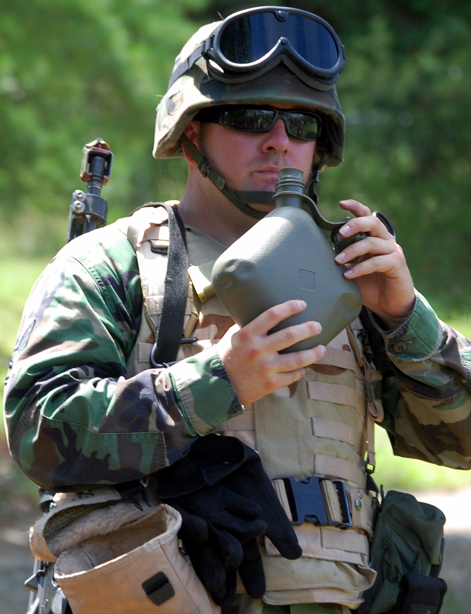 A student in the Advanced Contingency Skills Training Course takes a drink of water during a break in patrolling and tactics training for the course Aug. 12, 2008, on a range on Fort Dix, N.J.  The course, taught by the U.S. Air Force Expeditionary Center's 421st Combat Training Squadron, prepares Airmen from multiple career fields for upcoming deployments.  (U.S. Air Force Photo/Tech. Sgt. Scott T. Sturkol)