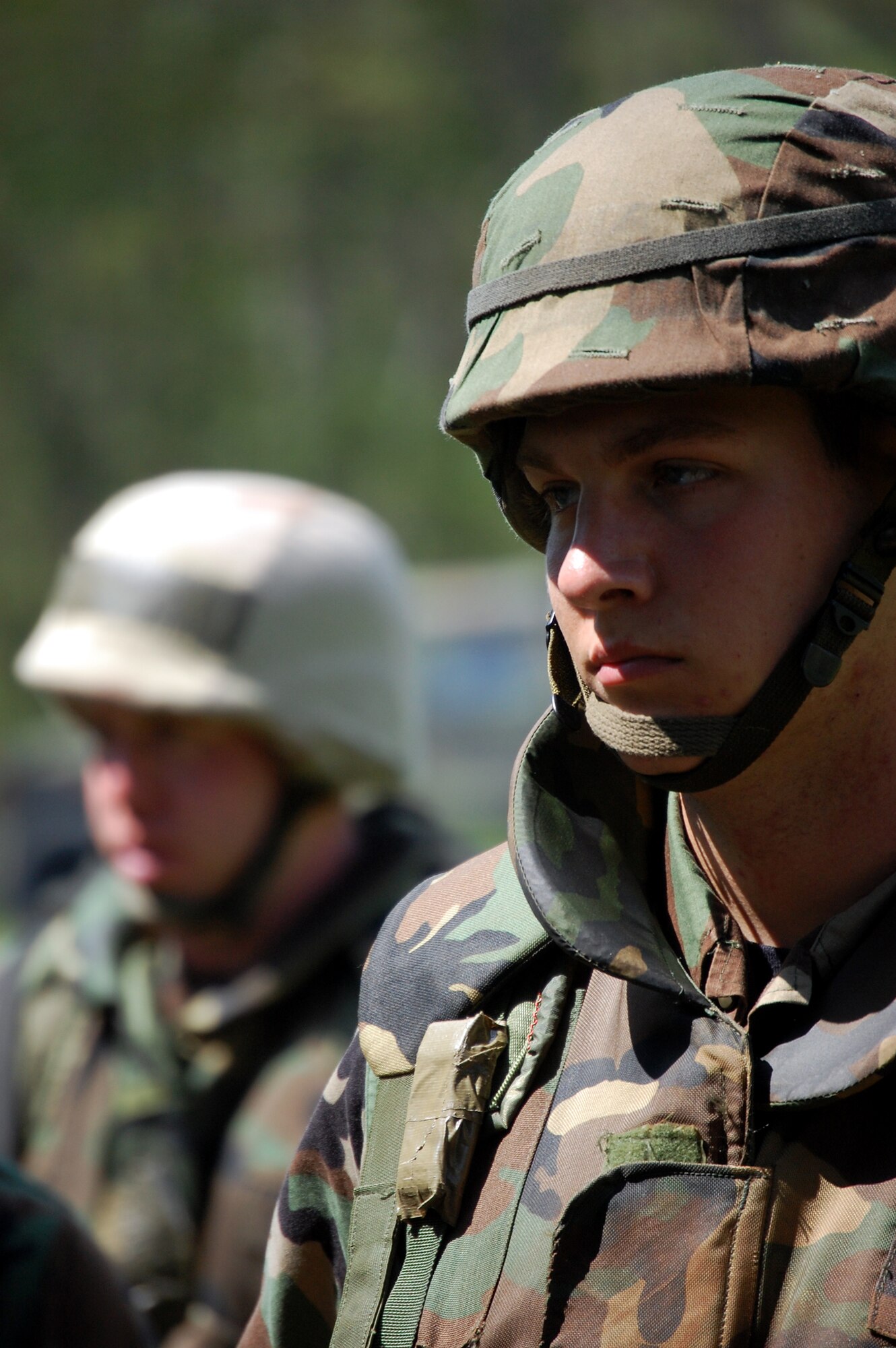 Students in the Advanced Contingency Skills Training Course listen to their instructor during patrolling and tactics training for the course Aug. 12, 2008, on a range on Fort Dix, N.J.  The course, taught by the U.S. Air Force Expeditionary Center's 421st Combat Training Squadron, prepares Airmen from multiple career fields for upcoming deployments.  (U.S. Air Force Photo/Tech. Sgt. Scott T. Sturkol)
