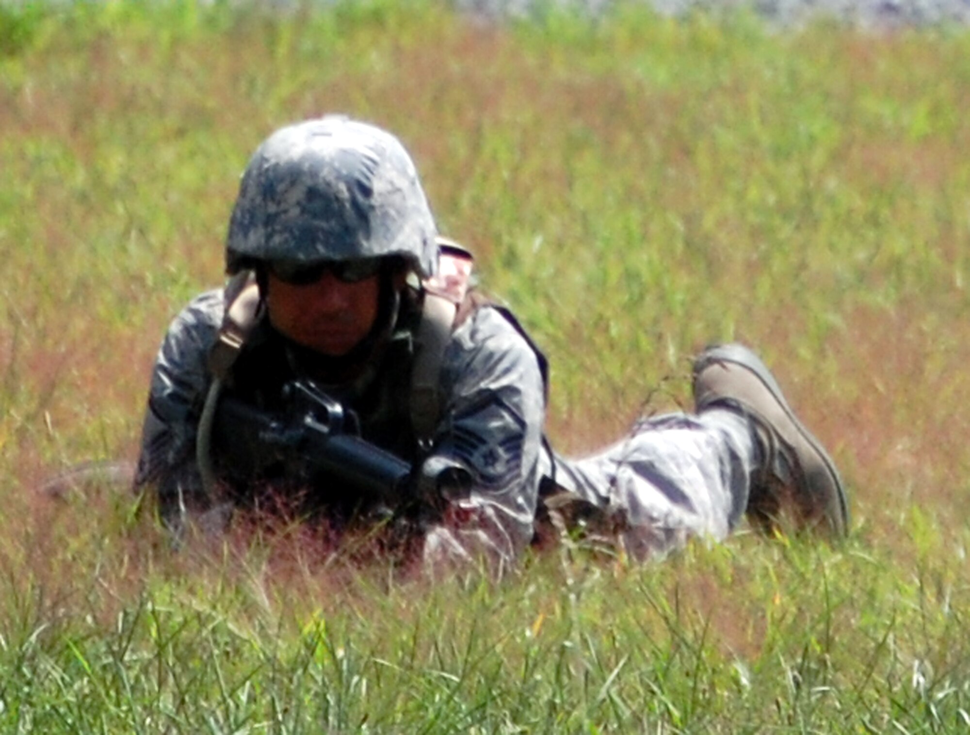 A student in the Advanced Contingency Skills Training Course participates in patrolling and tactics training for the course Aug. 12, 2008, on a range on Fort Dix, N.J.  The course, taught by the U.S. Air Force Expeditionary Center's 421st Combat Training Squadron, prepares Airmen from multiple career fields for upcoming deployments.  (U.S. Air Force Photo/Tech. Sgt. Scott T. Sturkol)