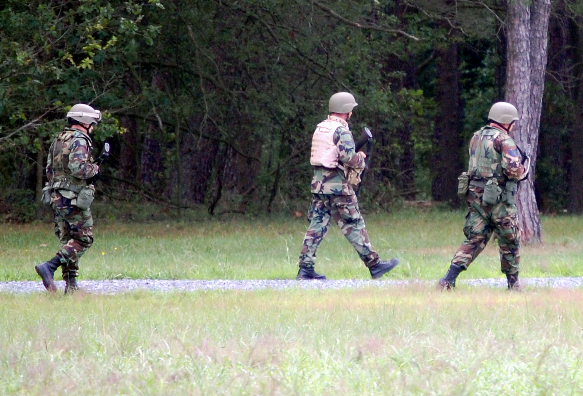 Students in the Advanced Contingency Skills Training Course march in a file formation during patrolling and tactics training for the course Aug. 12, 2008, on a range on Fort Dix, N.J.  The course, taught by the U.S. Air Force Expeditionary Center's 421st Combat Training Squadron, prepares Airmen from multiple career fields for upcoming deployments.  (U.S. Air Force Photo/Tech. Sgt. Scott T. Sturkol)
