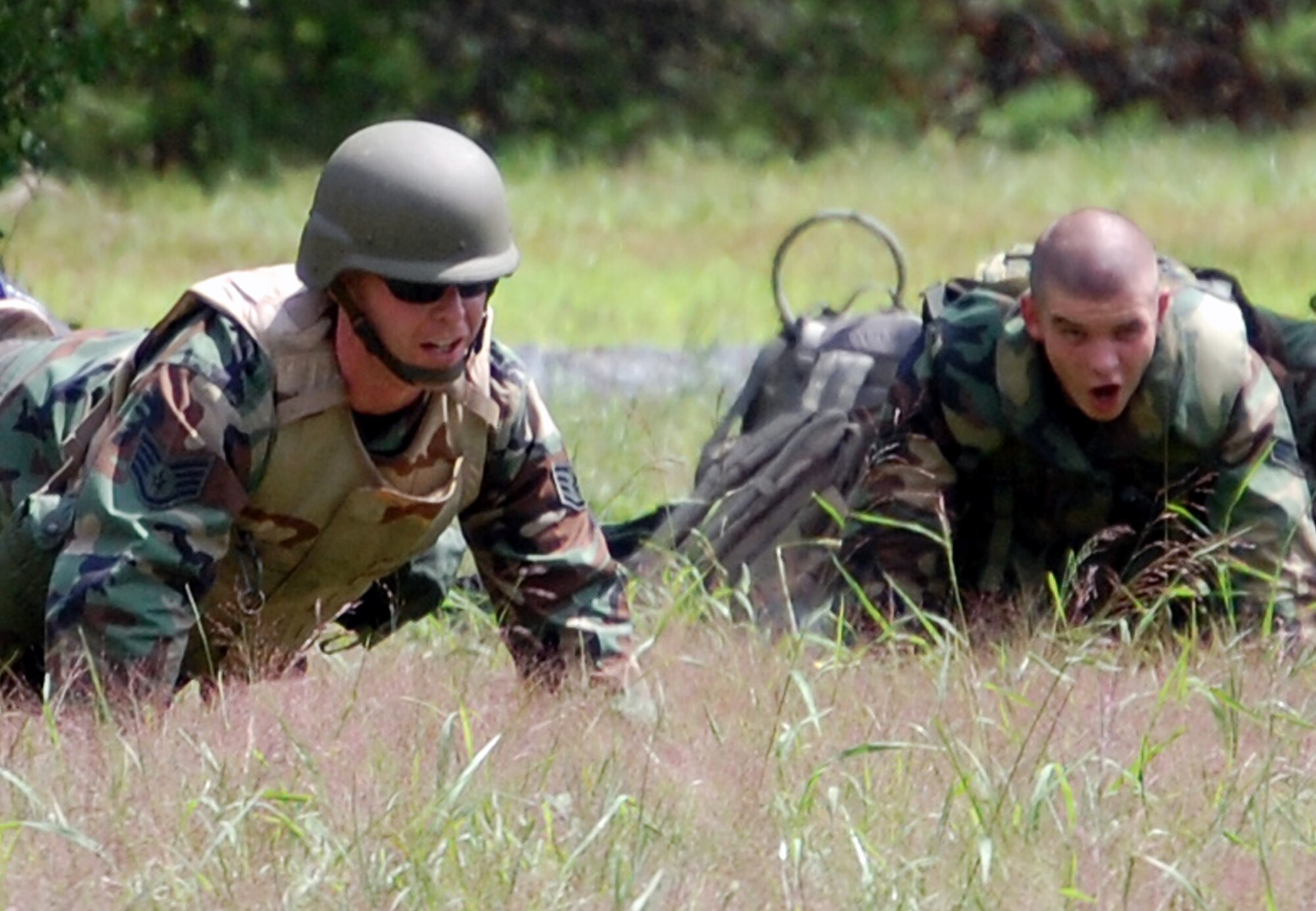 Students in the Advanced Contingency Skills Training Course perform some push-ups in between training in patrolling and tactics for the ACST Aug. 12, 2008, on a range on Fort Dix, N.J.  The course, taught by the U.S. Air Force Expeditionary Center's 421st Combat Training Squadron, prepares Airmen from multiple career fields for upcoming deployments.  (U.S. Air Force Photo/Tech. Sgt. Scott T. Sturkol)