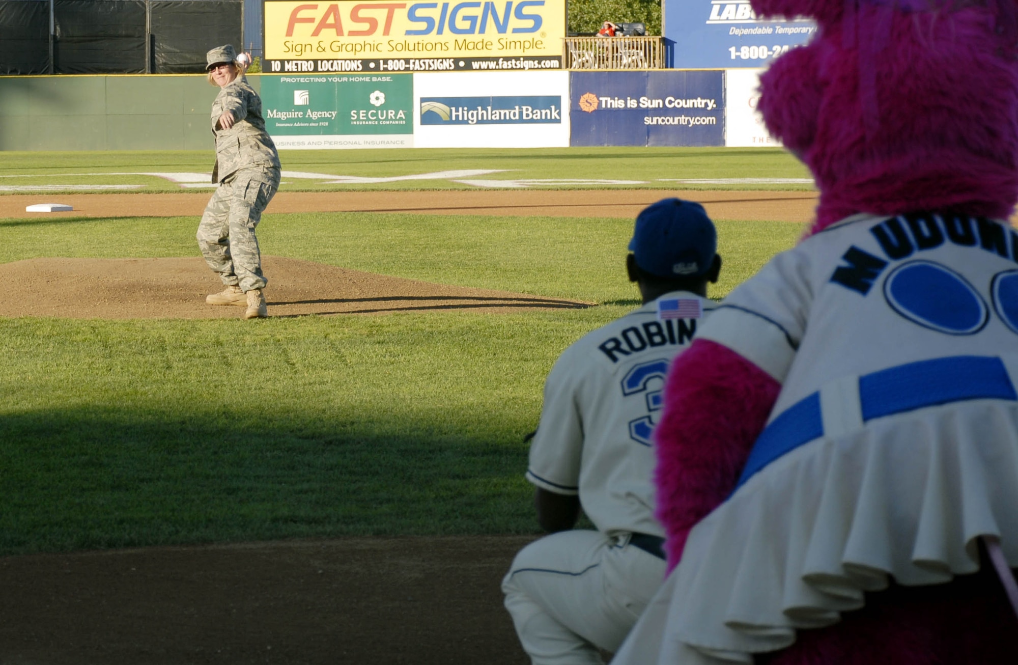 Tech. Sgt. Suzzanne Harwood, 934th Airlift Wing NCO of the Year, throws out the first pitch at a St. Paul Saints baseball game Aug. 7.  Sergeant Harwood serves as the wing career advisor at the 934th and also assisted recruiters promoting the Air Force Reserve at the game.
(Air Force Photo/Master Sgt. Paul Zadach).