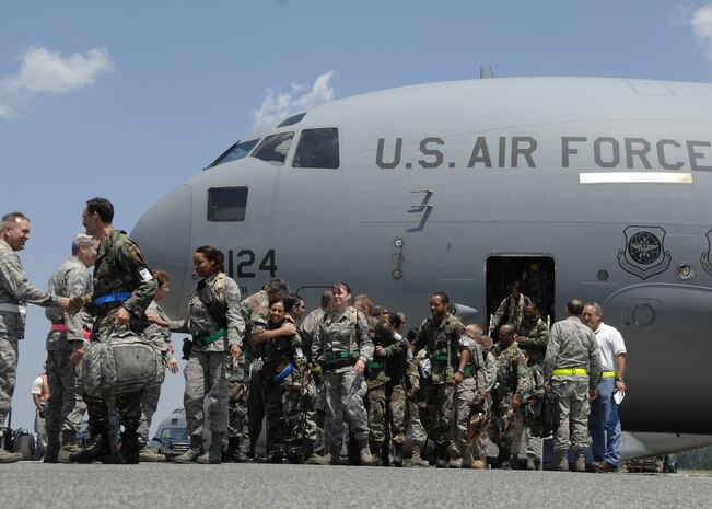 Team Charleston Airmen return to Charleston AFB Aug. 9 at the end of the operational readiness inspection which was held at a simulated air base in East Asia. Air Mobility Command inspectors will brief the results of the inspection in the base theater Aug. 15 at 10 a.m. (U.S. Air Force photo/Airman 1st Class Katie Gieratz)